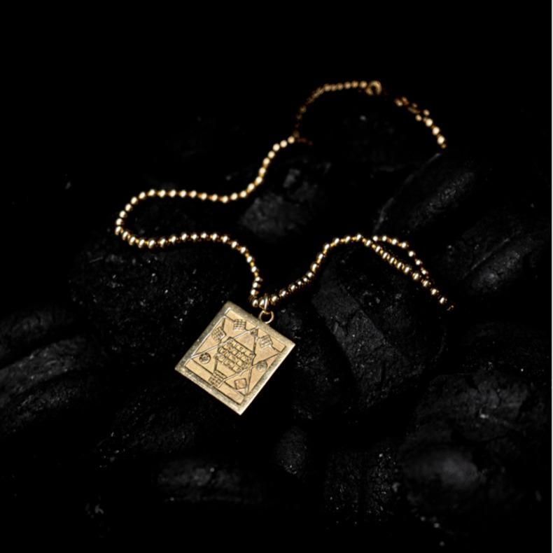 Is a 10 grams solid gold 18k pendant, with a sumerian code design, named holy table.
