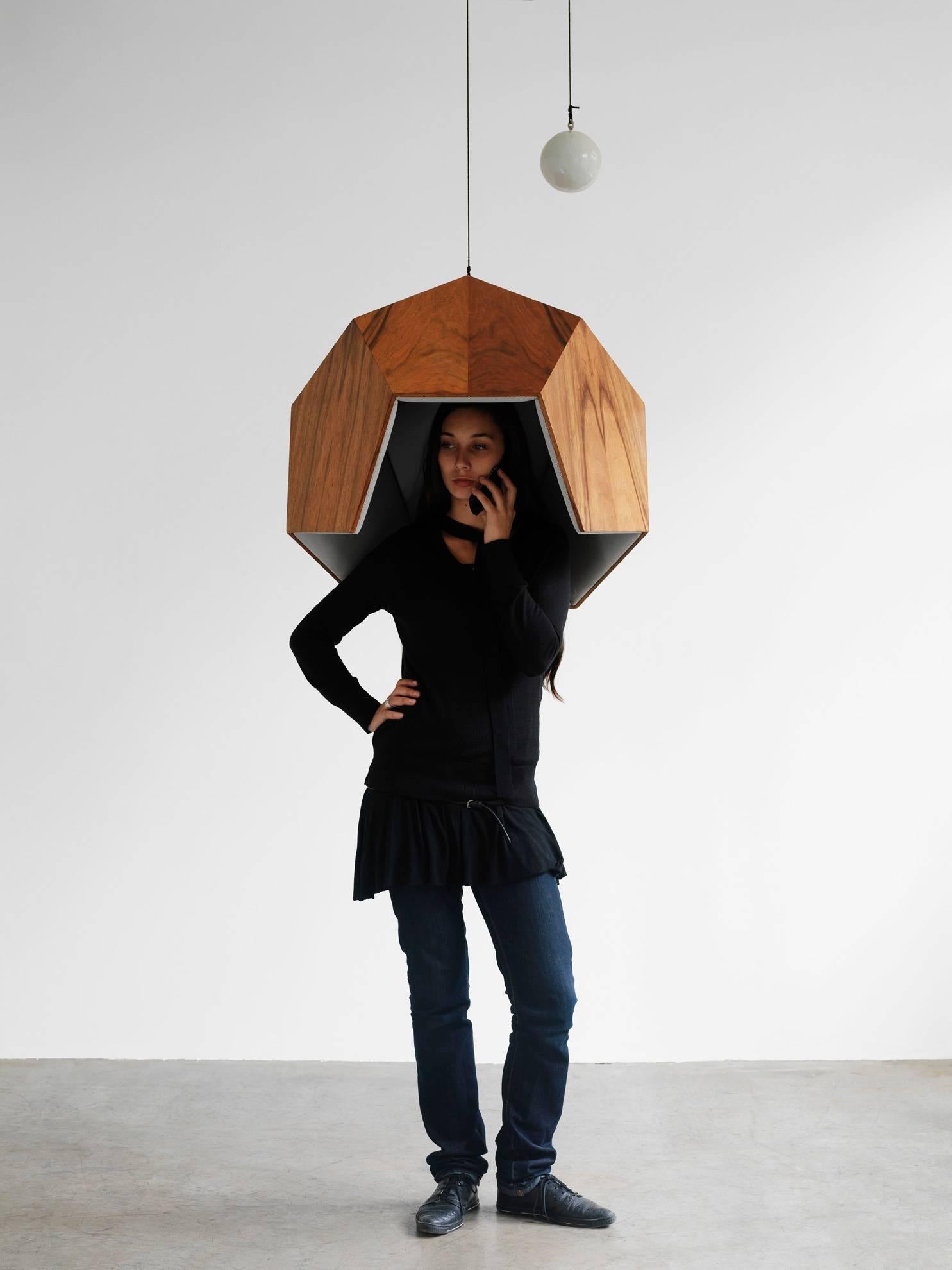 This object creates a subspace within a public area, making it possible to isolate oneself from the surrounding noise. It is reminiscent of a phone box, but it is an empty shell, because nowadays we carry our own phones. The interior is lined with