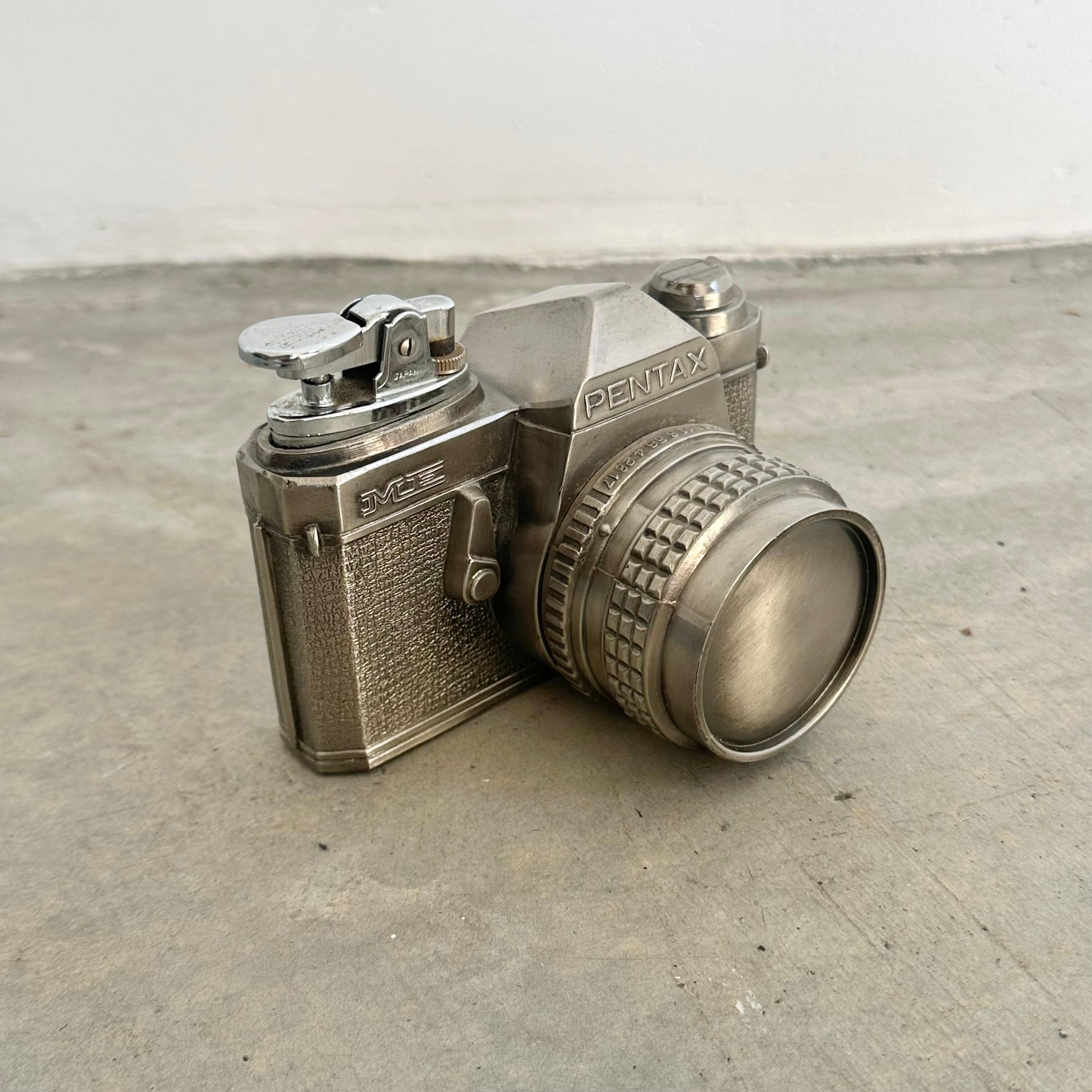 Take home this incredible vintage Pentax Camera Lighter while it's still on the market. Rare and in perfect working condition. Adjustable lighter with a strong flame.

Artist took extra care to include all details and copyright on this Pentax copy.