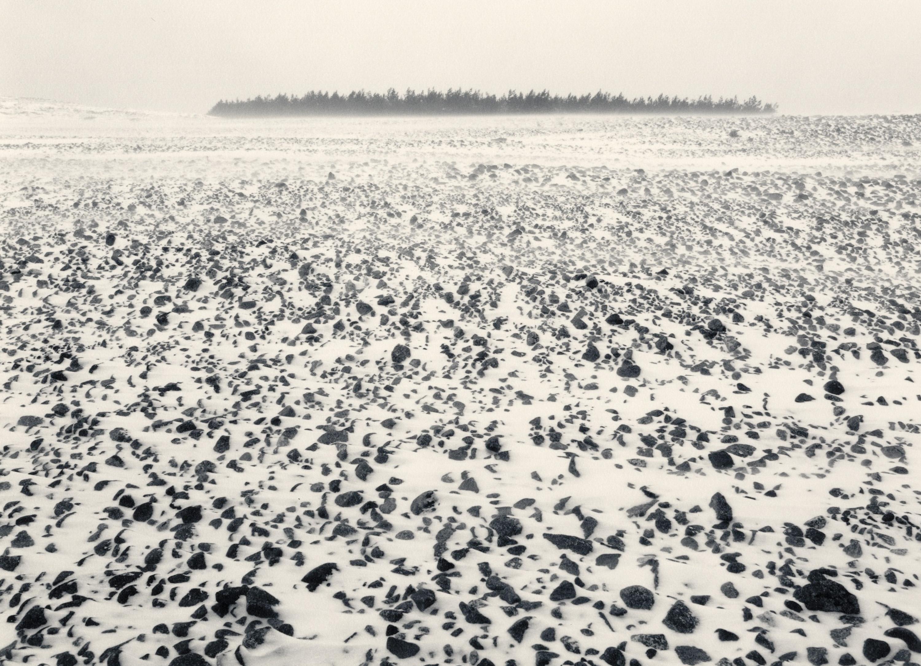Pentti Sammallahti Black and White Photograph - Jurmo, Finland (Rocky landscape w/snow, forest on horizon)