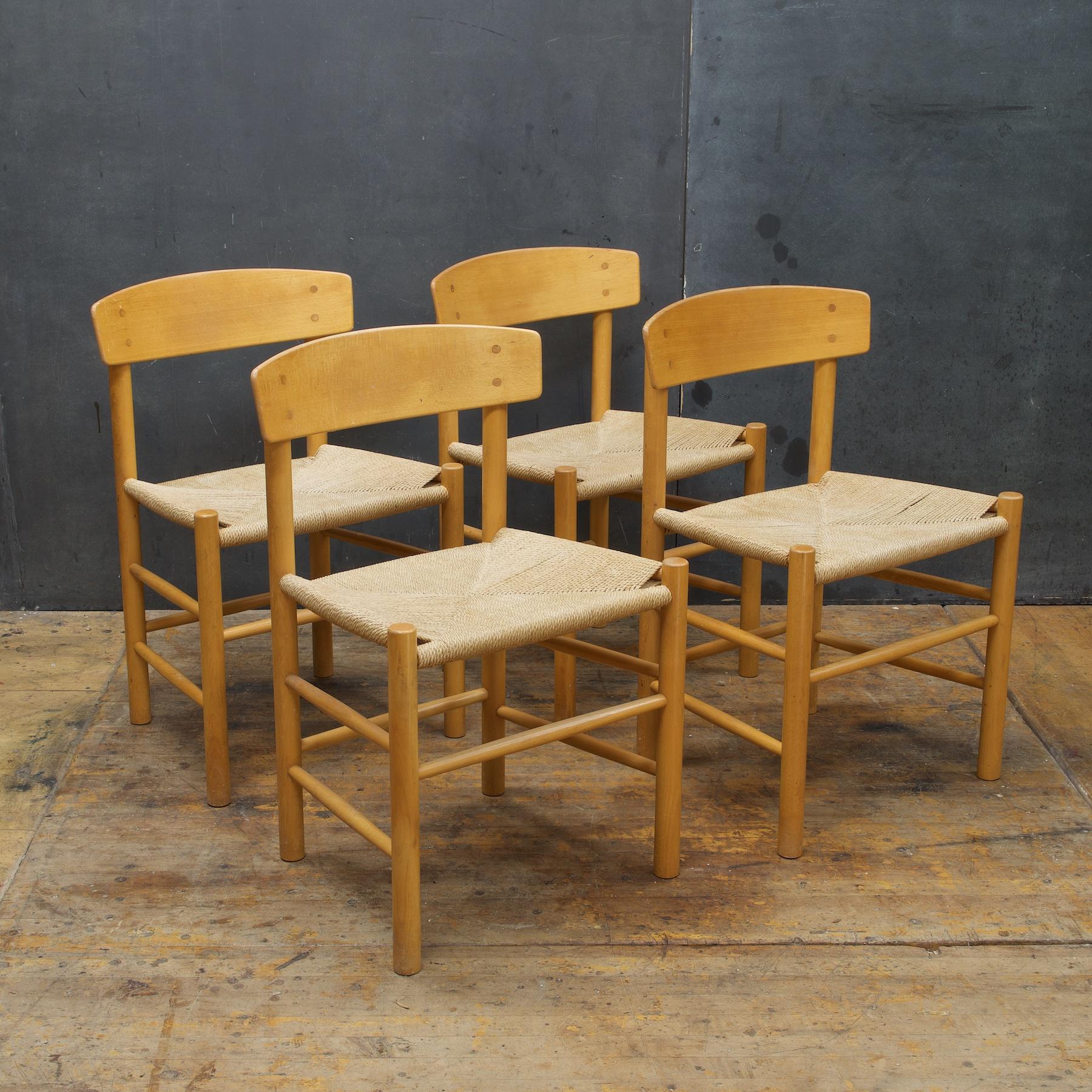 Fun, rustic Set. Sturdy and usable, cord is lightly stained, soiled, and worn. All seat cord remains unbroken and strong. FDB Model J39 Baltic birch and cord (Rope/Rush) dining side chairs.
 