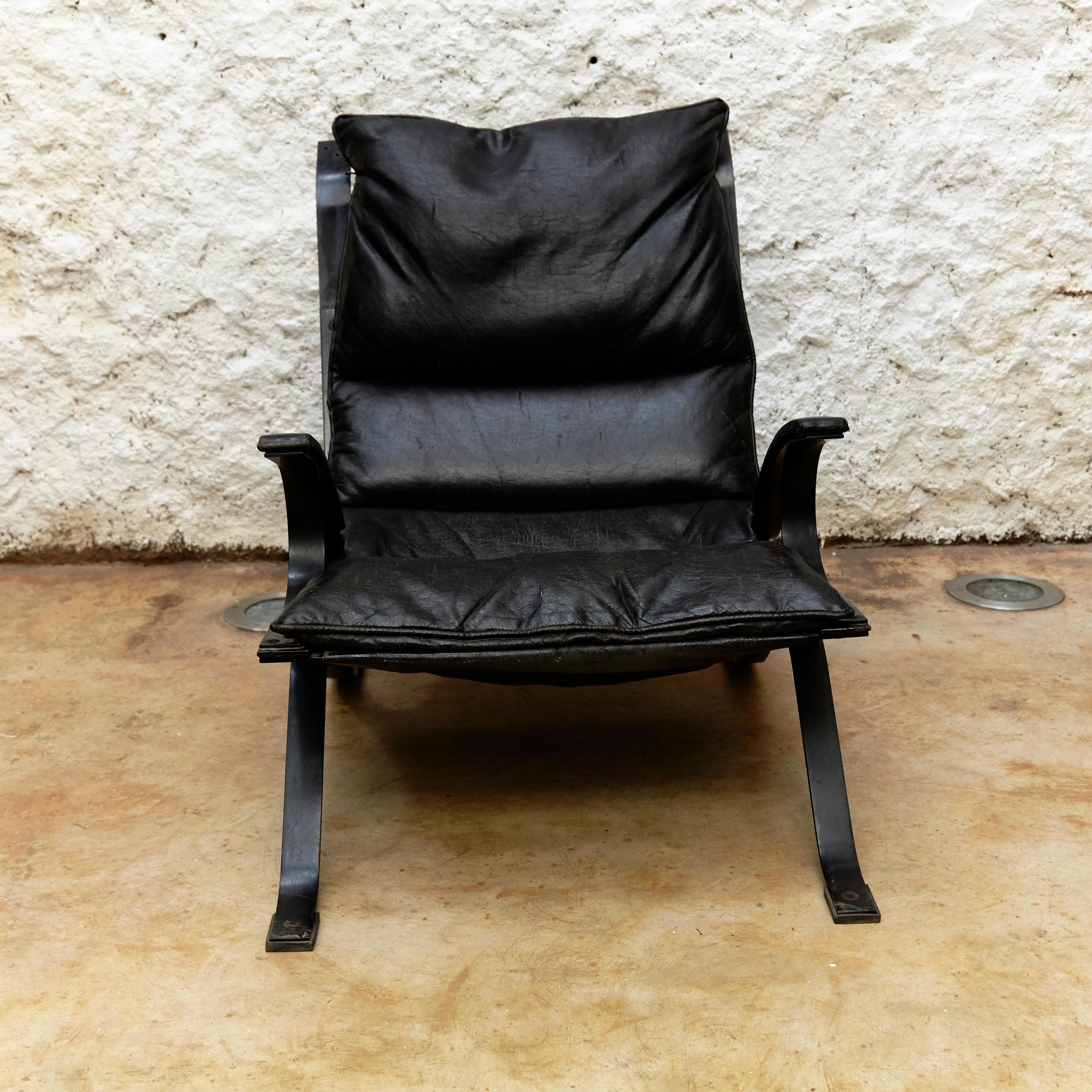 Lounge chair designed by Pep Bonet for Levesta manufactured in Spain, 1969.

Lacquered plated steel frame and original black leatherette.

In original condition, with minor wear consistent with age and use, preserving a beautiful patina. Some