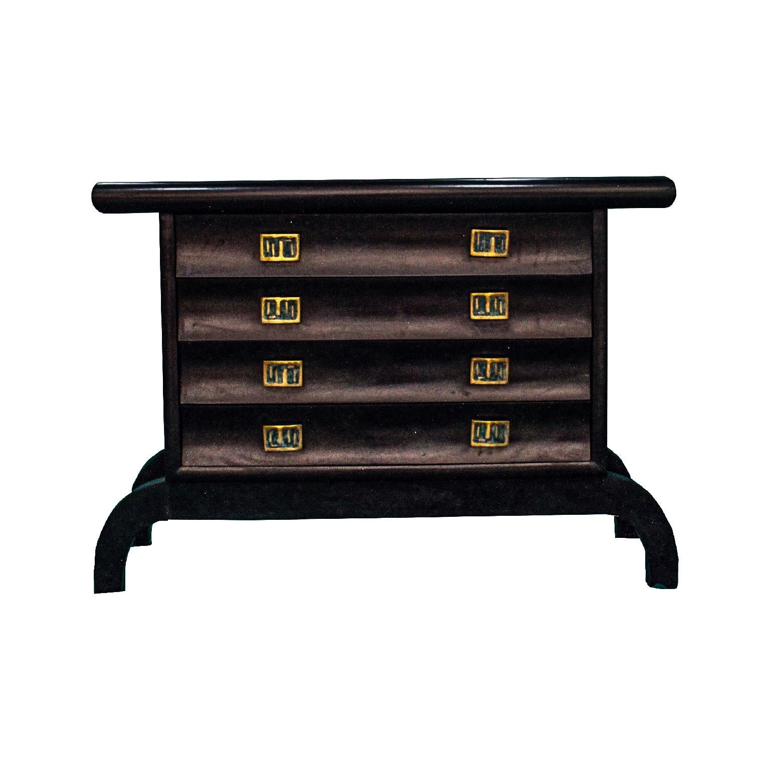 Pepe Mendoza chest of drawers in matte black
with four drawers and 8 brass jaladeras with malachite and the seal of Pepe Mendoza. The legs have a slight curve making it very stabile and modernist design.