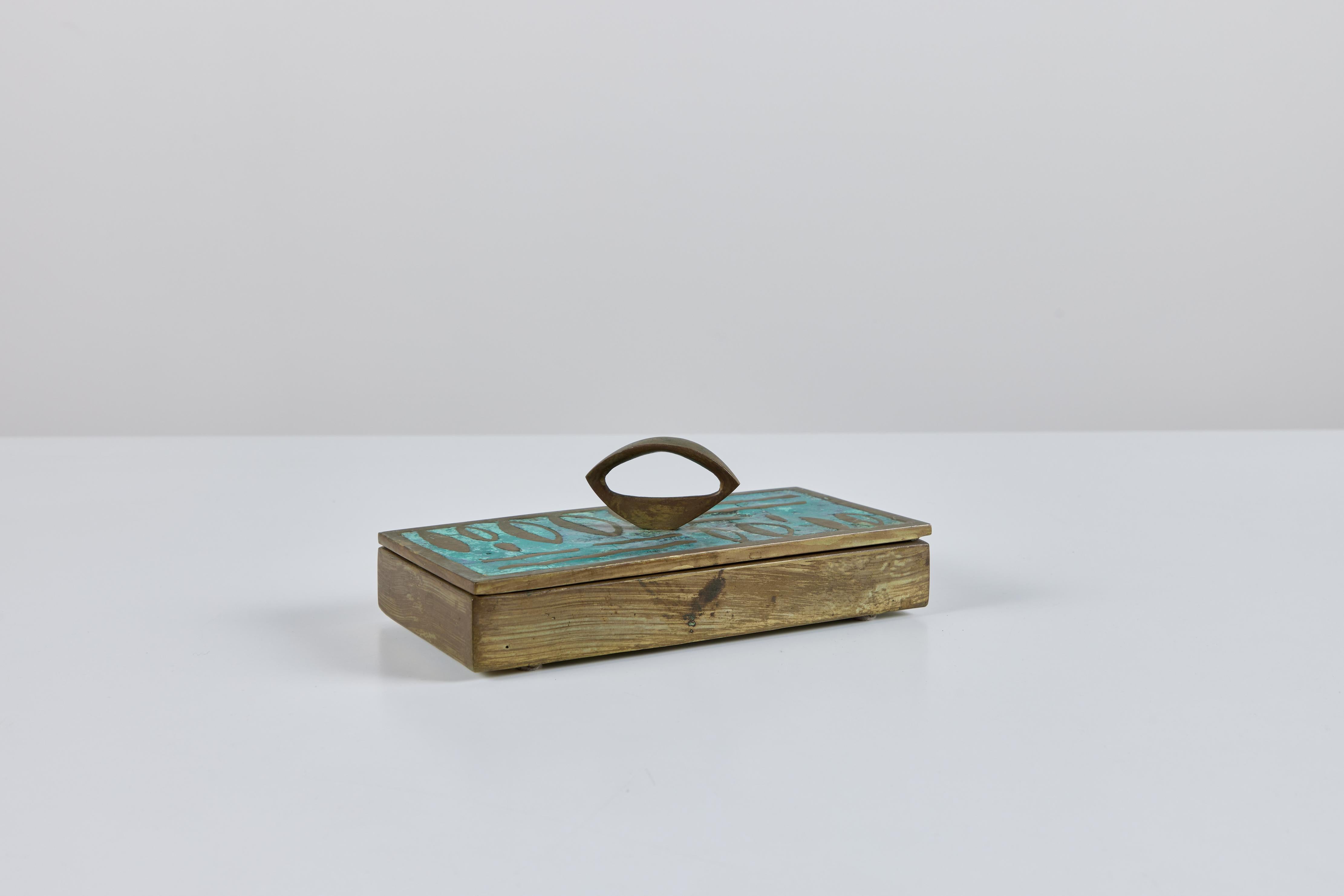 José Mendoza ran a foundry called Pepe Mendoza in the 1950s and 1960s in Mexico City, manufacturing modernist home accessories using a modified cloissonné technique more suited to the tastes of the day. 

This example is a rectangular lidded box