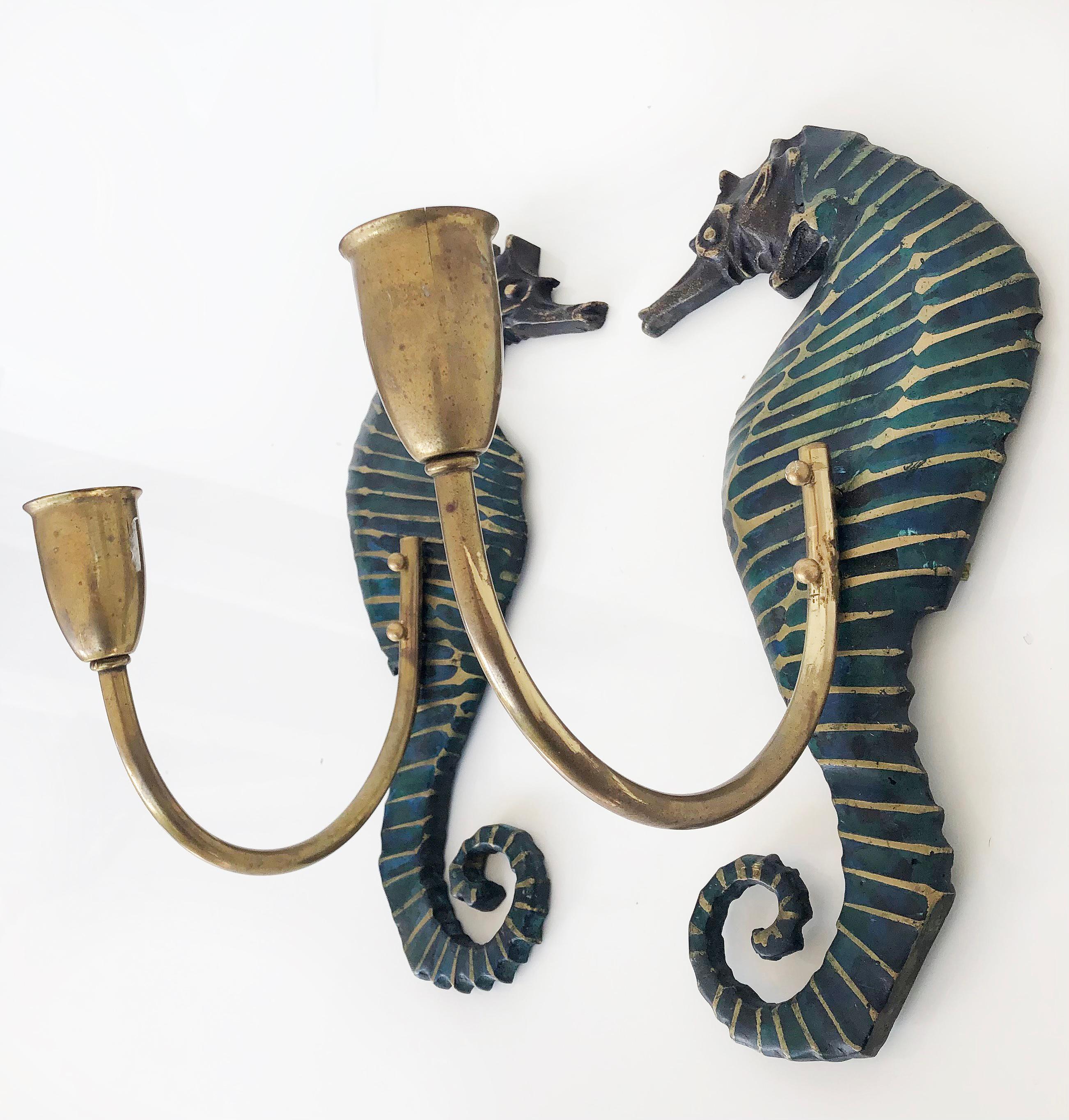 Pepe Mendoza 1960s brass malachite seahorse sconces, pair

Offered for sale is a pair of Pepe Mendoza Mexican Mid-Century Modern brass and malachite seahorse sconces. The pair has been wired and is ready to install. The sconces are identical in size