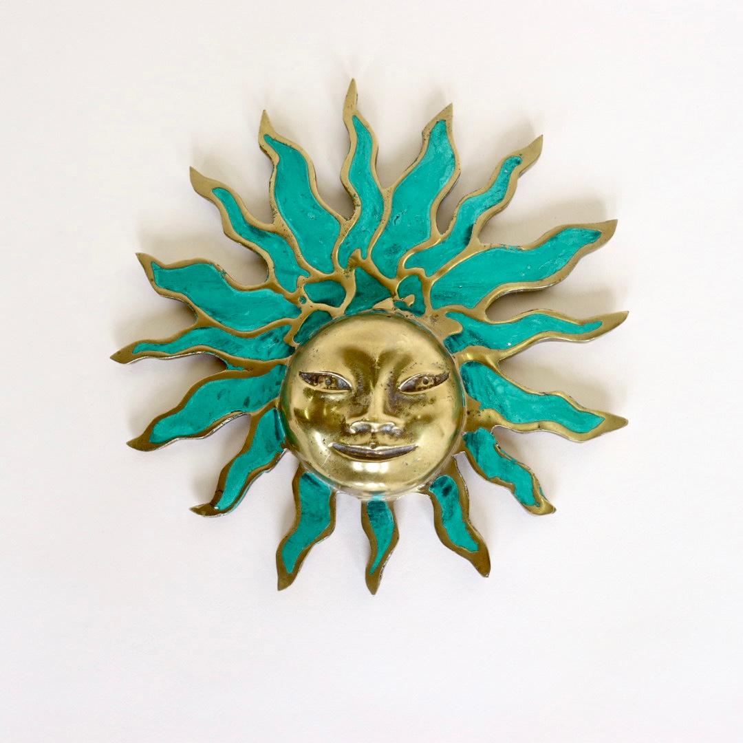 This is a beautiful piece of wall art by Mexican artist Pepe Mendoza. Known for his use of bronze, Pepe Mendoza's famous Sun Face sculpture features radiant Bronze and Malachite Turquoise. Pepe Mendoza Studio Pieces where made in small production