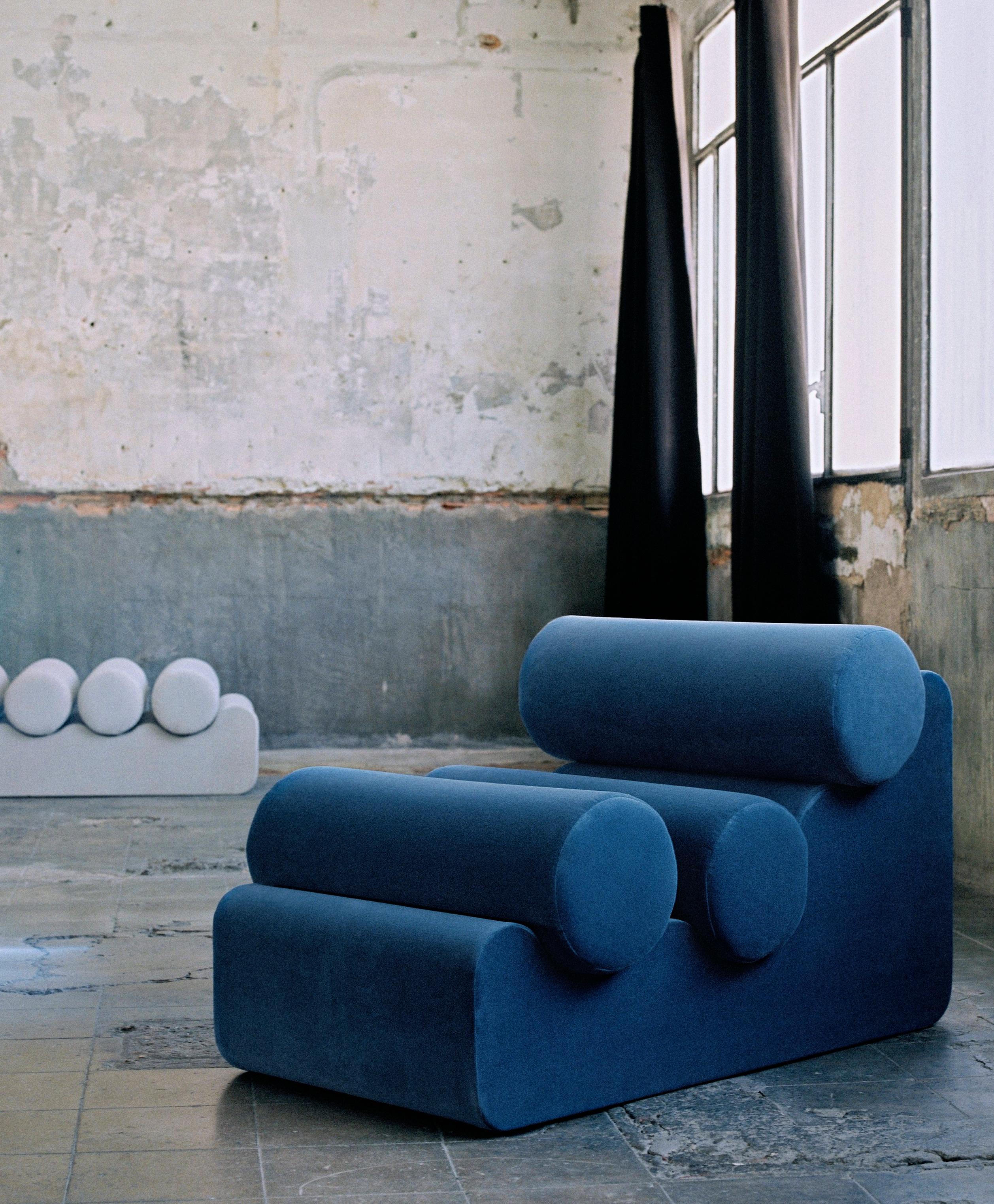 Pepino chair by Owl
Dimensions: L 112 x W 70 x H 60 cm
Materials: Plywood base, upholstered 

La Pepino is a collection of only seating, which consists of the repetition of cylindrical cushions, supported by an organically shaped base. Every