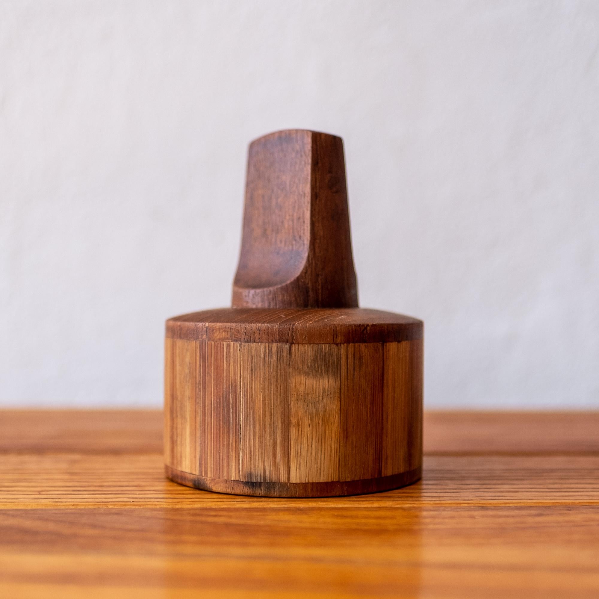 Rare and early pepper mill by Jens Quistgaard in teak and split bamboo. It has the earliest grinding mechanism, which was produced in France. The mill was produced by Dansk in Denmark, circa 1960s. Also included is a butcher block, also designed by