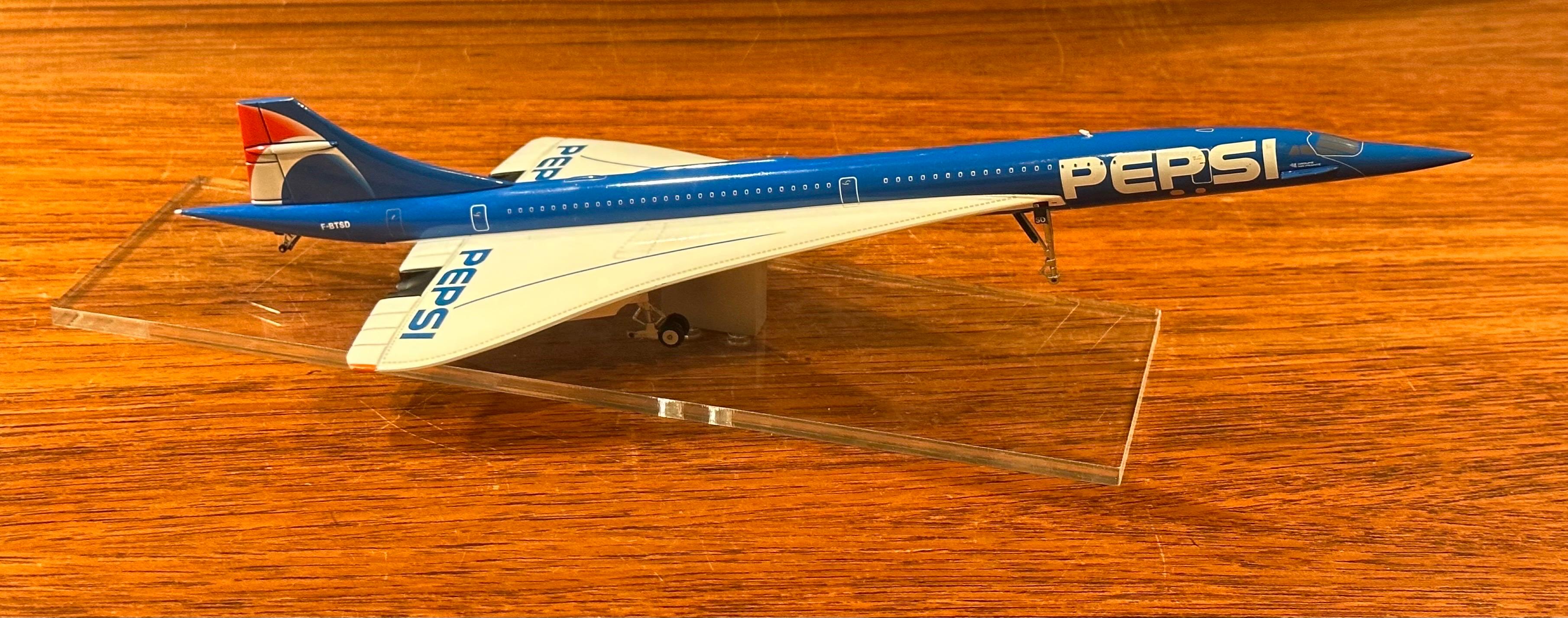 Cast Pepsi Logoed Concorde Jetliner Desk Model on Lucite Base For Sale