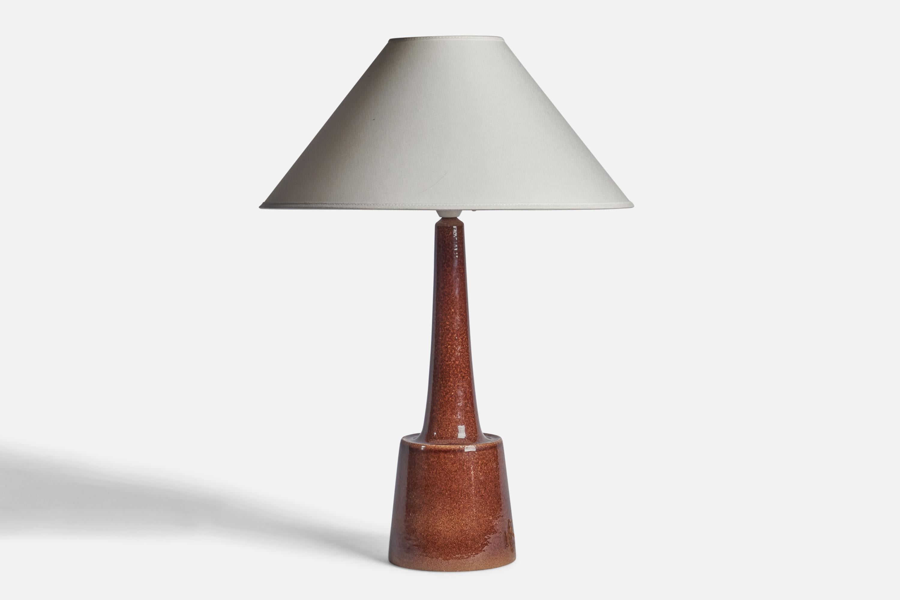 A brown-glazed stoneware table lamp designed by Per & Annelise Linneman-Schmidt and produced by Palshus, Denmark, 1960s

Dimensions of Lamp (inches): 17.65 H x 5.45” Diameter
Dimensions of Shade (inches): 4.5” Top Diameter x 16” Bottom Diameter x