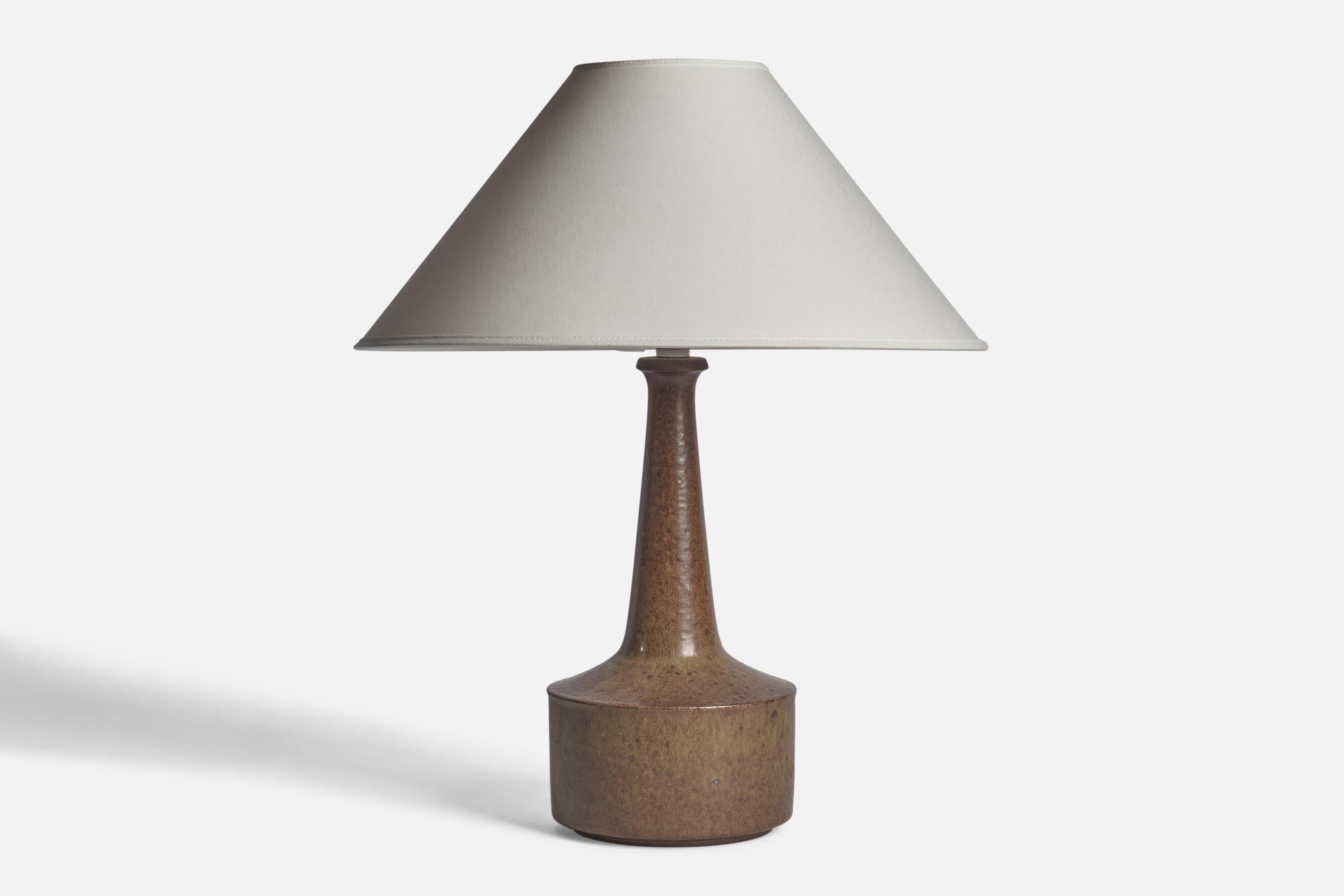 A brown-glazed stoneware table lamp designed by Per & Annelise Linneman-Schmidt and produced by Palshus, Denmark, 1960s

Dimensions of Lamp (inches): 14.5” H x 6.25” Diameter
Dimensions of Shade (inches): 4.5” Top Diameter x 16” Bottom Diameter x