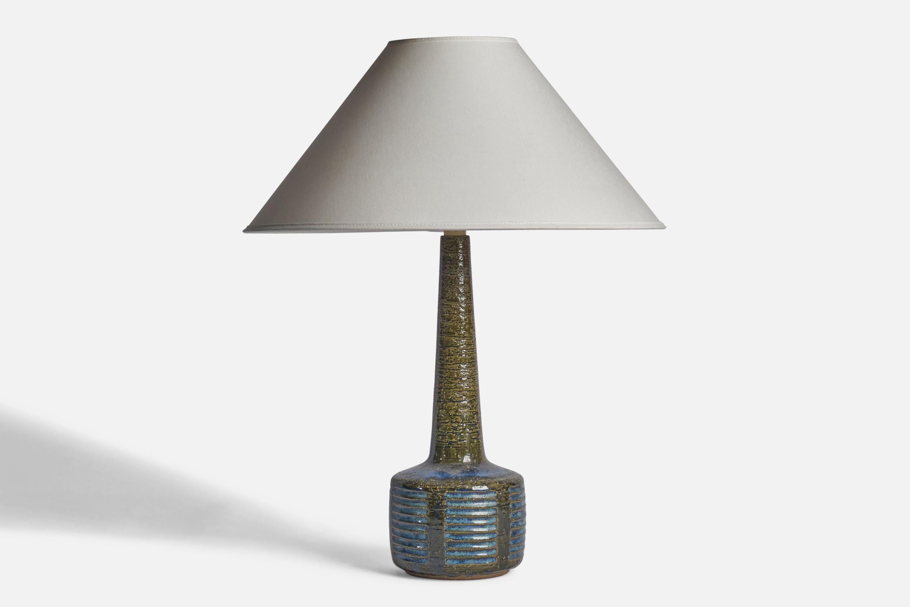 A blue and green-glazed stoneware table lamp designed by Per & Annelise Linneman-Schmidt and produced by Palshus, Denmark, 1960s

Dimensions of Lamp (inches): 15.25” H x 5” Diameter
Dimensions of Shade (inches): 4.5” Top Diameter x 16” Bottom