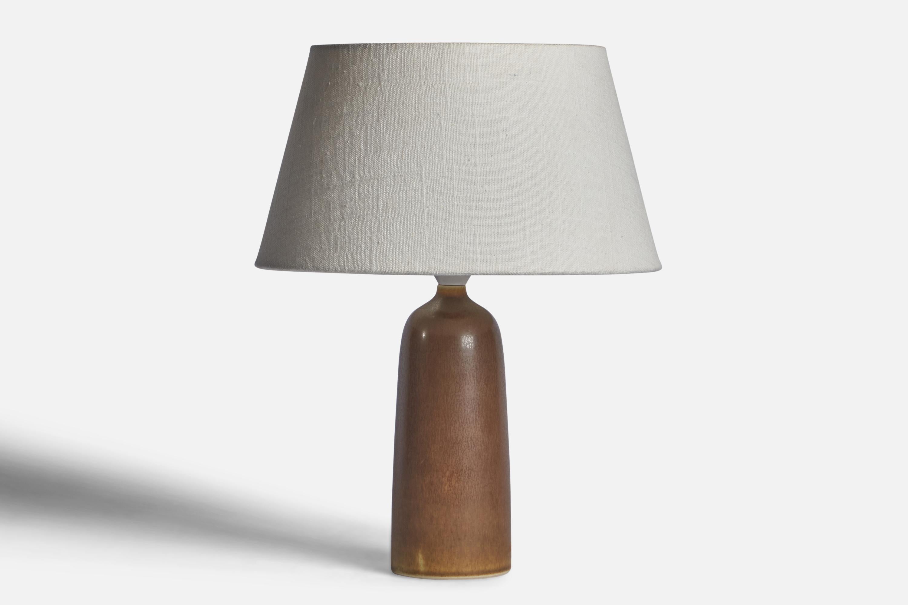A brown-glazed stoneware table lamp designed by Per & Annelise Linneman-Schmidt and produced by Palshus, Denmark, 1960s

Dimensions of Lamp (inches): 10.25” H x 3” Diameter
Dimensions of Shade (inches): 7” Top Diameter x 10” Bottom Diameter x