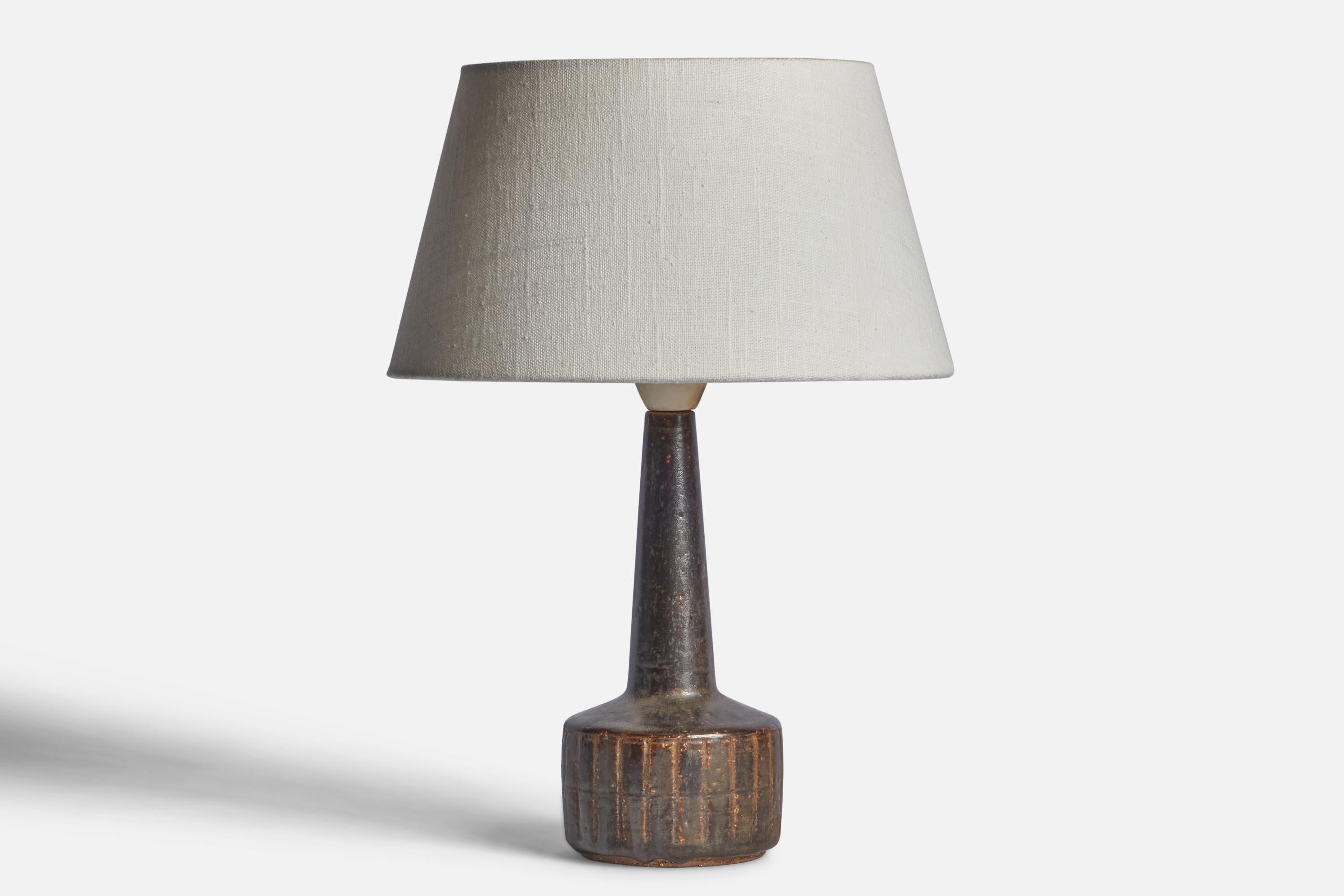 A brown-glazed stoneware table lamp designed by Per & Annelise Linneman-Schmidt and produced by Palshus, Denmark, 1960s.

Dimensions of Lamp (inches): 10.85” H x 4” Diameter
Dimensions of Shade (inches): 7” Top Diameter x 10” Bottom Diameter x