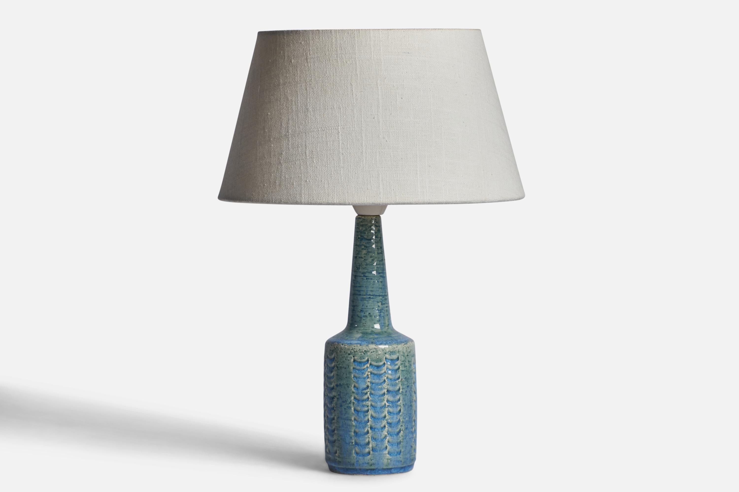 A blue-glazed stoneware table lamp designed by Per & Annelise Linneman-Schmidt and produced by Palshus, Denmark, 1960s.

Dimensions of Lamp (inches): 11.35” H x 3” Diameter
Dimensions of Shade (inches): 7” Top Diameter x 10” Bottom Diameter x