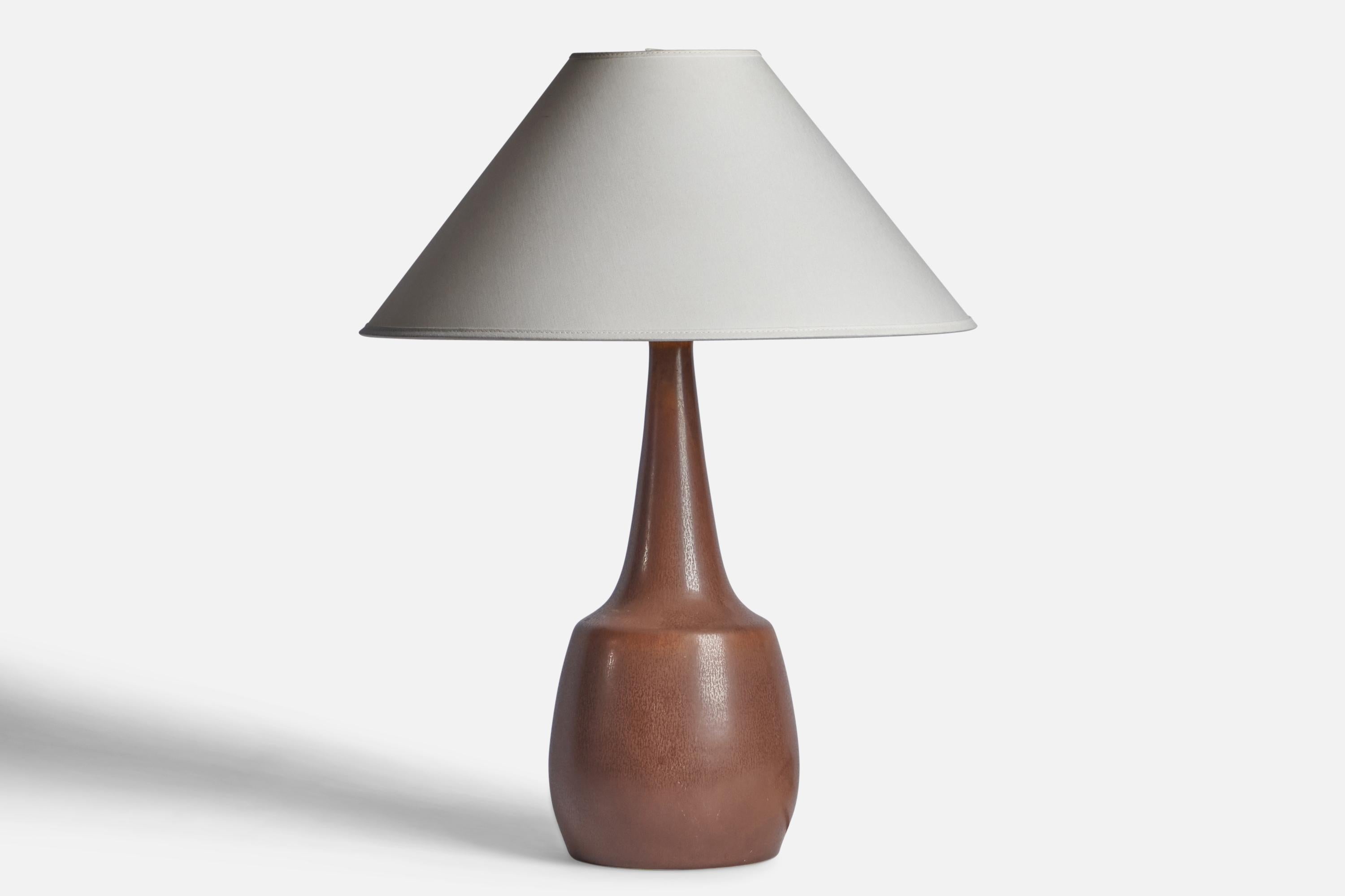 A brown-glazed stoneware table lamp designed by Per & Annelise Linneman-Schmidt and produced by Palshus, Denmark, 1960s.

Dimensions of Lamp (inches): 16.75” H x 6.25” Diameter
Dimensions of Shade (inches): 4.5” Top Diameter x 16” Bottom Diameter x