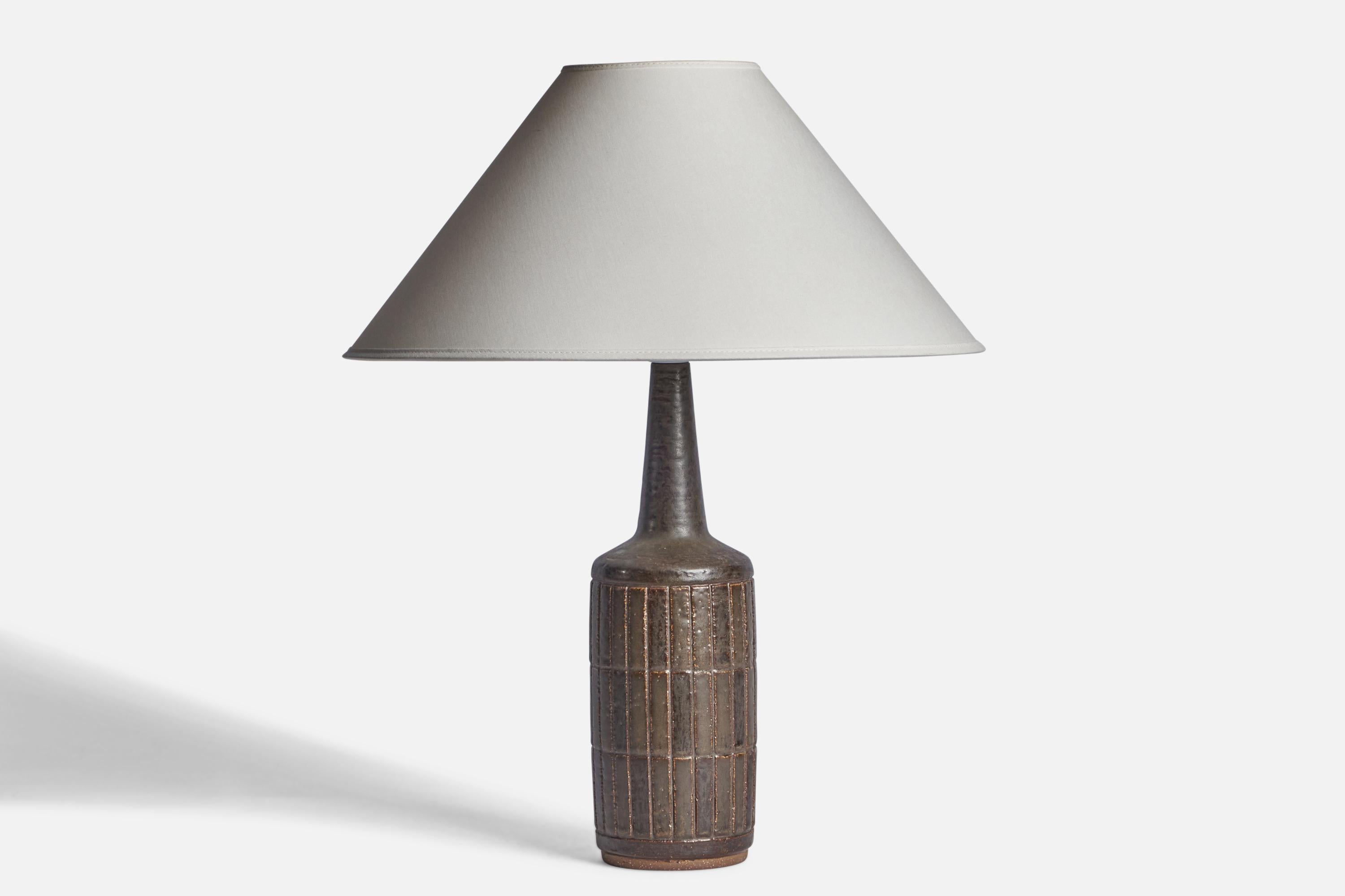 A brown-glazed stoneware table lamp designed by Per & Annelise Linneman-Schmidt and produced by Palshus, Denmark, 1960s.

Dimensions of Lamp (inches): 15.5” H x 4” Diameter
Dimensions of Shade (inches): 4.5” Top Diameter x 16” Bottom Diameter x
