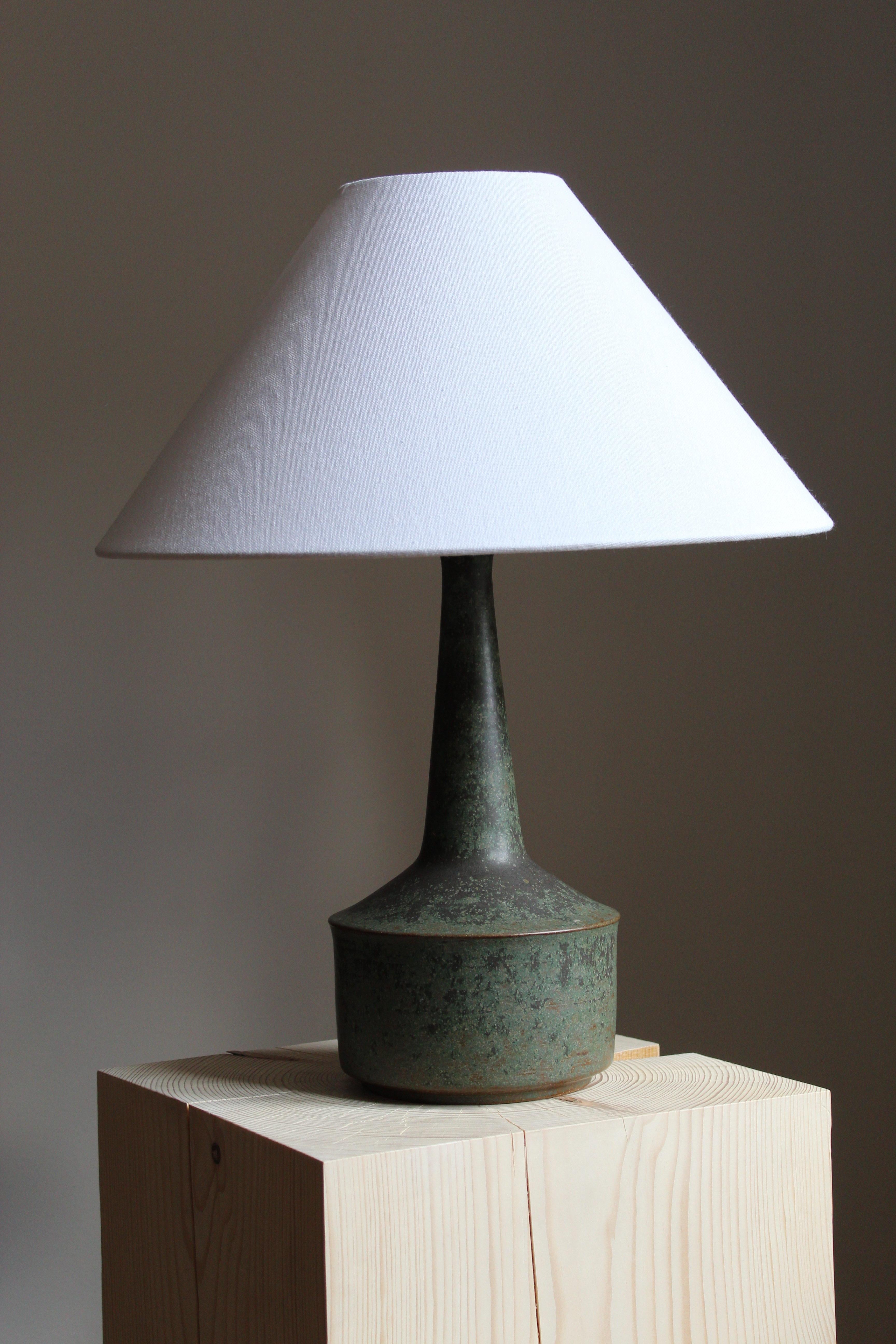 A large table / desk lamp designed by husband and wife Per & Annelise Linneman-Schmidt. Handcast in stoneware. Produced in their own Studio, named Palshus, in Sengeløse, Denmark. Signed.

Sold without lampshade. Stated dimensions exclude