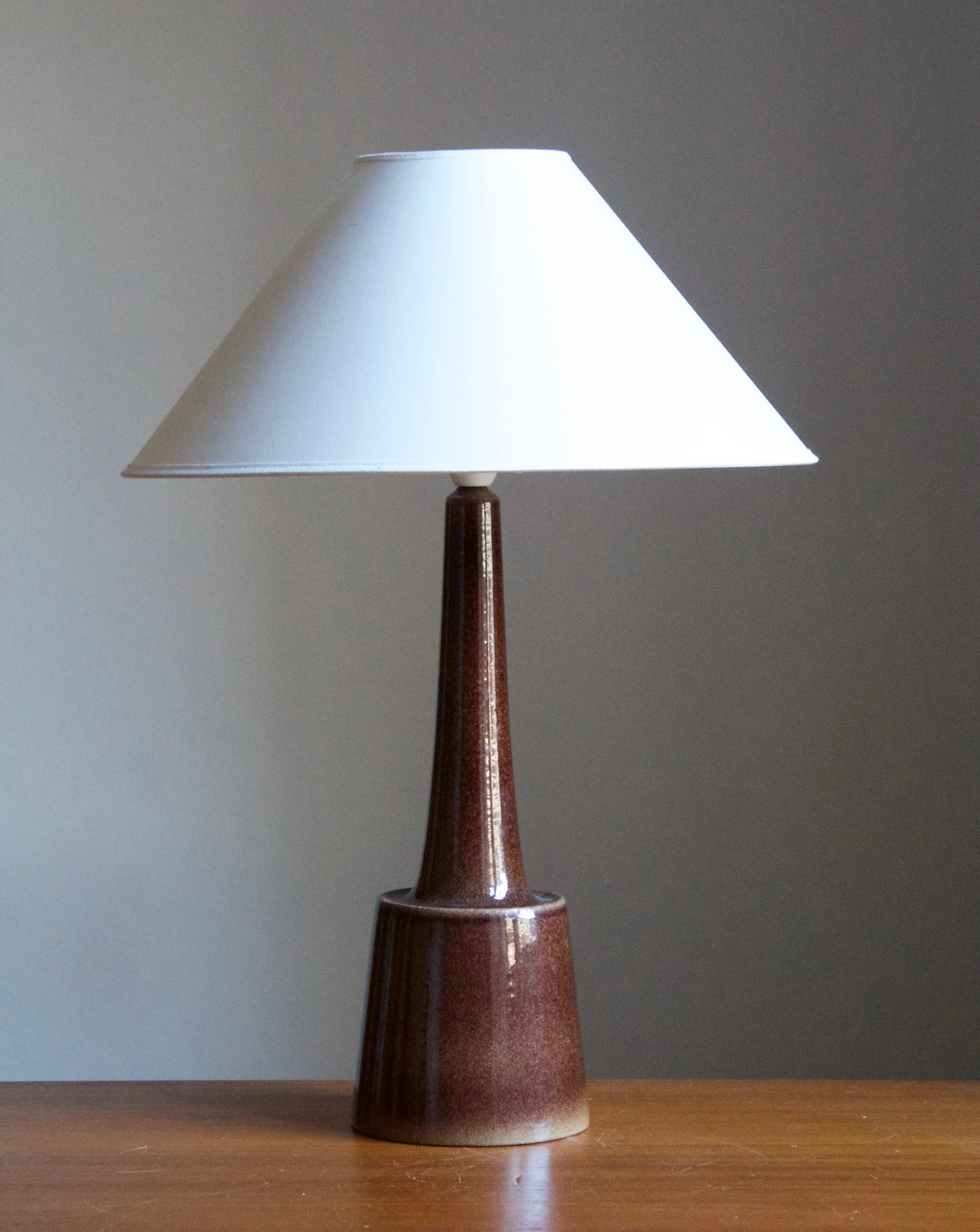 A table / desk lamp attributed to husband and wife Per & Annelise Linneman-Schmidt. Handcast in stoneware. Presumably produced in their own Studio, named Palshus, in Sengeløse, Denmark. Unsigned and unmarked.

Sold without lampshade. Stated