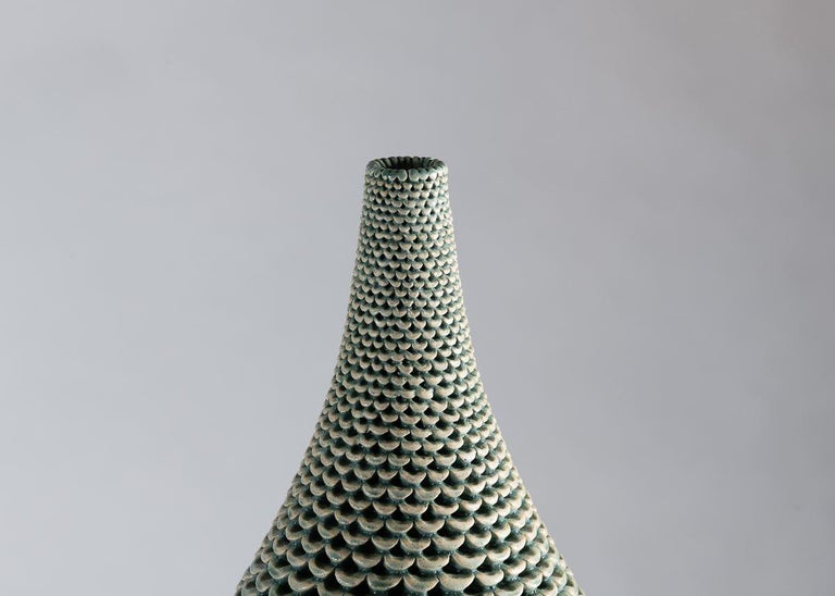The vases of Swedish ceramist Per Liljegren possess a an elegant symmetry of form and exteriors of mesmerizing detail.