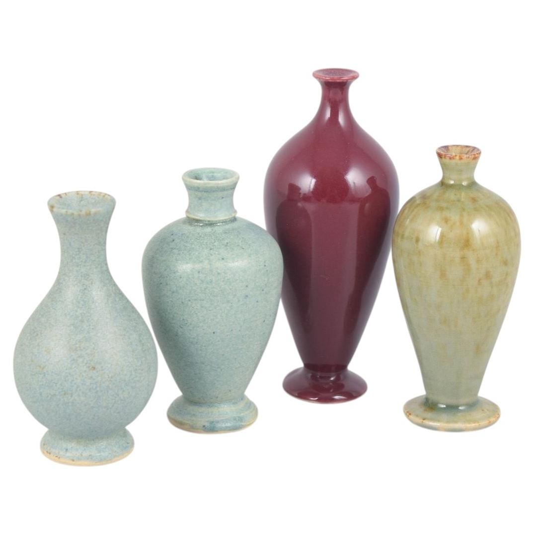 Per Liljegren. Set of four miniature stoneware vases. 1980s/90s