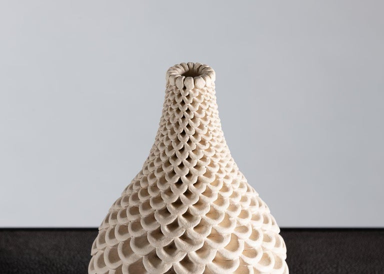 The vases of Swedish ceramist Per Liljegren possess an elegant symmetry of form and exteriors of mesmerizing detail.