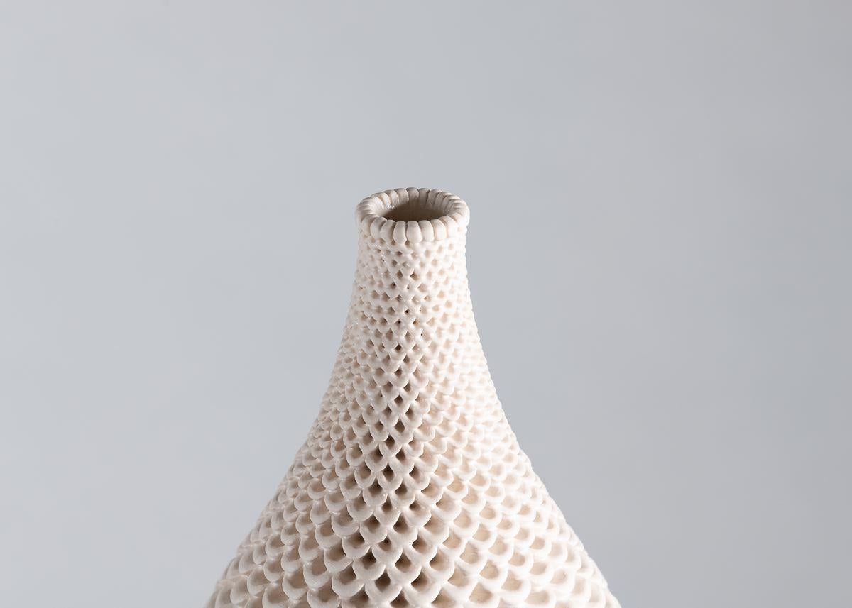 The vases of Swedish ceramist Per Liljegren possess an elegant symmetry of form and exteriors of mesmerizing detail.