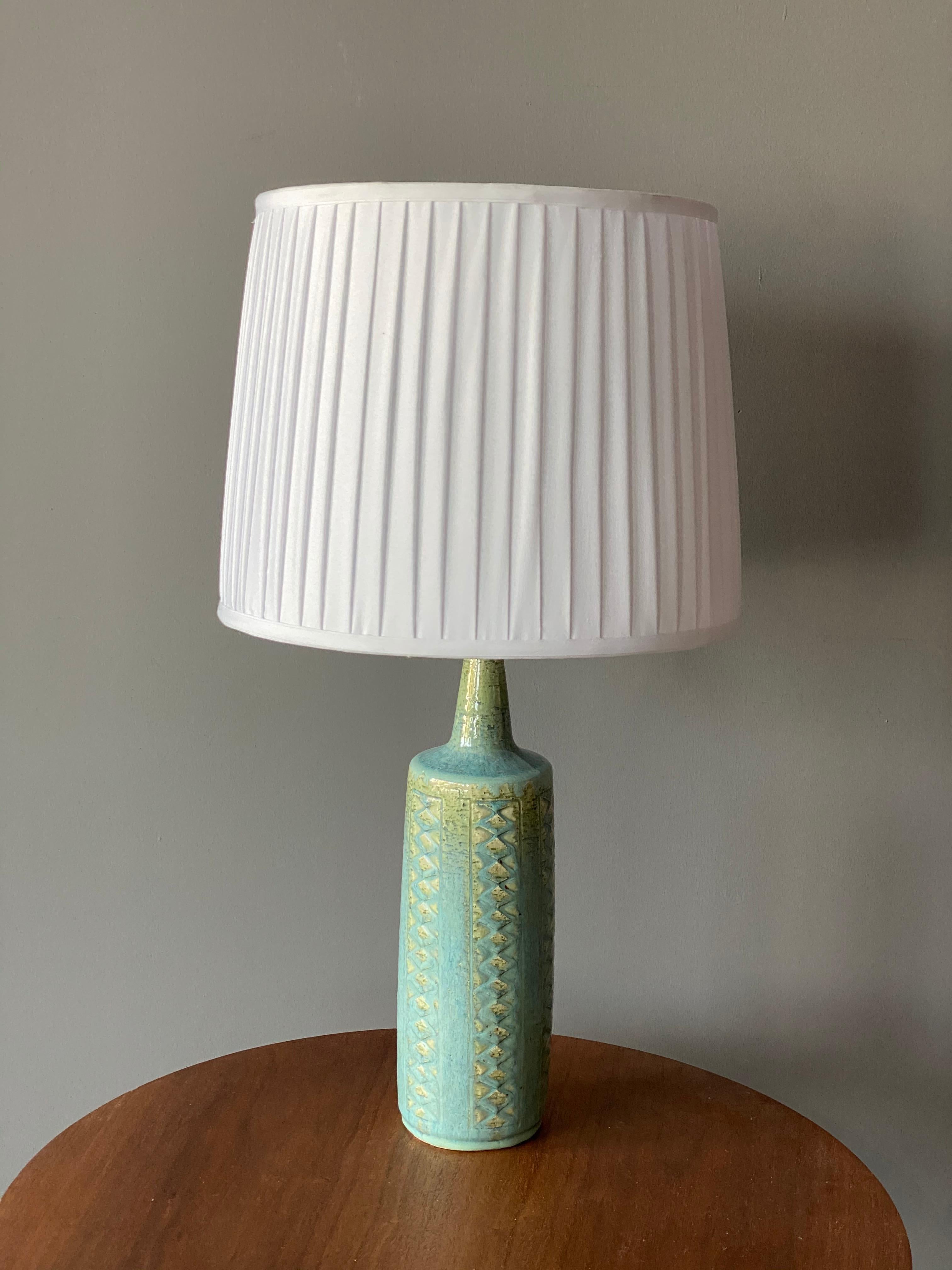 A table / desk lamp designed by husband and wife Per & Annelise Linneman-Schmidt. Handcast in firesand. Produced in their own Studio, named Palshus, in Sengeløse, Denmark. Signed.

The lampshade is attached for reference and not included in the