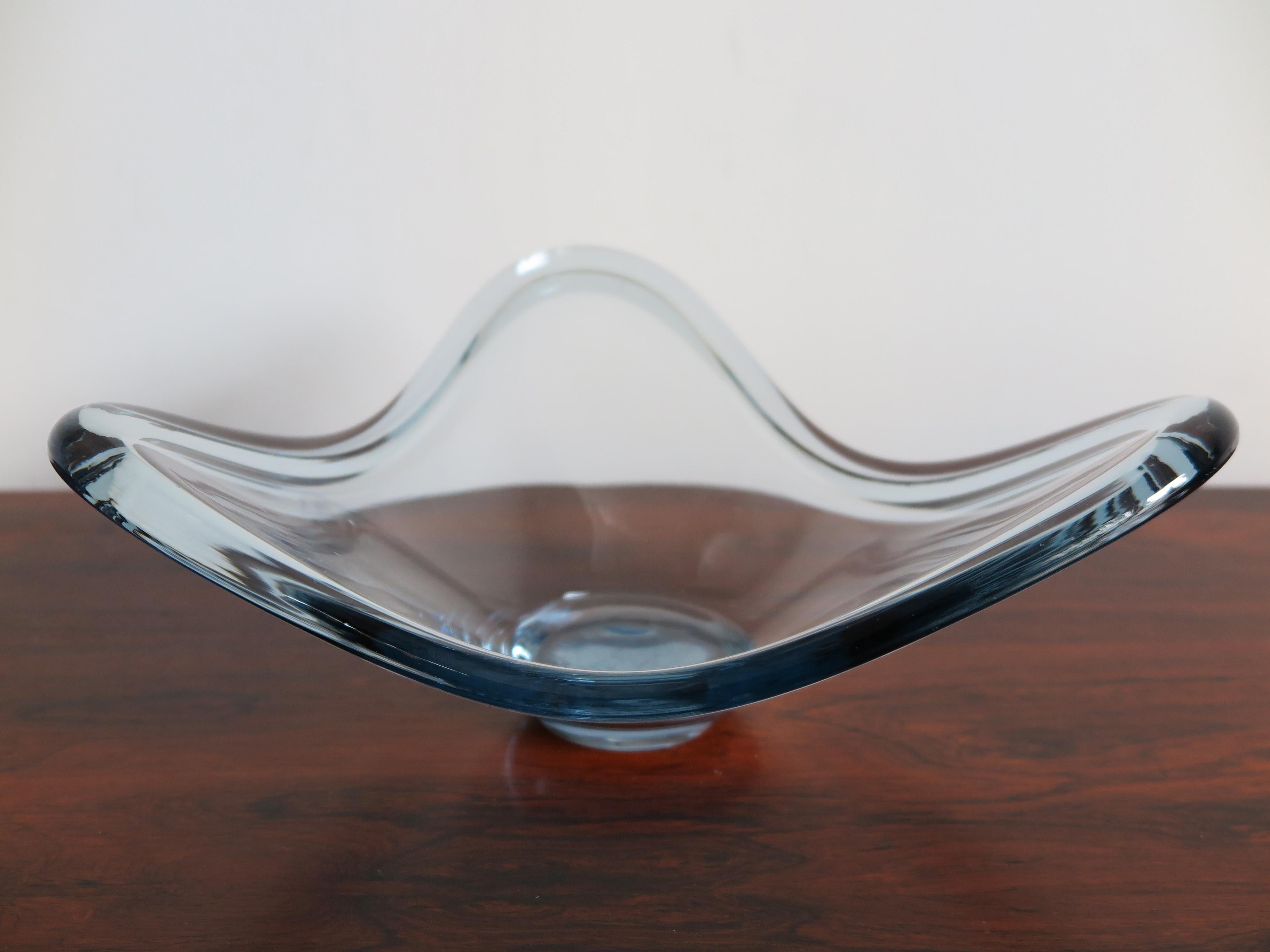 Scandinavian glass light blue vase centerpiece designed by danish artist Per Lütken and produced by Holmegaard, signature and numbering engraved on the bottom, 1960s

Please note that the item is original of the period and this shows normal signs