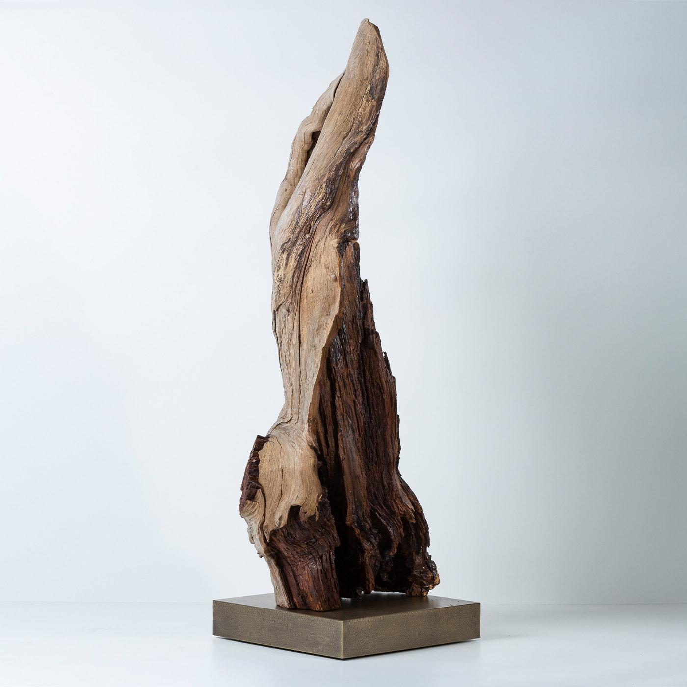 Crafted out of a single piece of weathered chestnut, this intriguing sculpture will be an intriguing focal point in sophisticated rustic-chic decors. The unpredictable yet unique detailing of its silhouette lends it its one-off charm, sealed by the