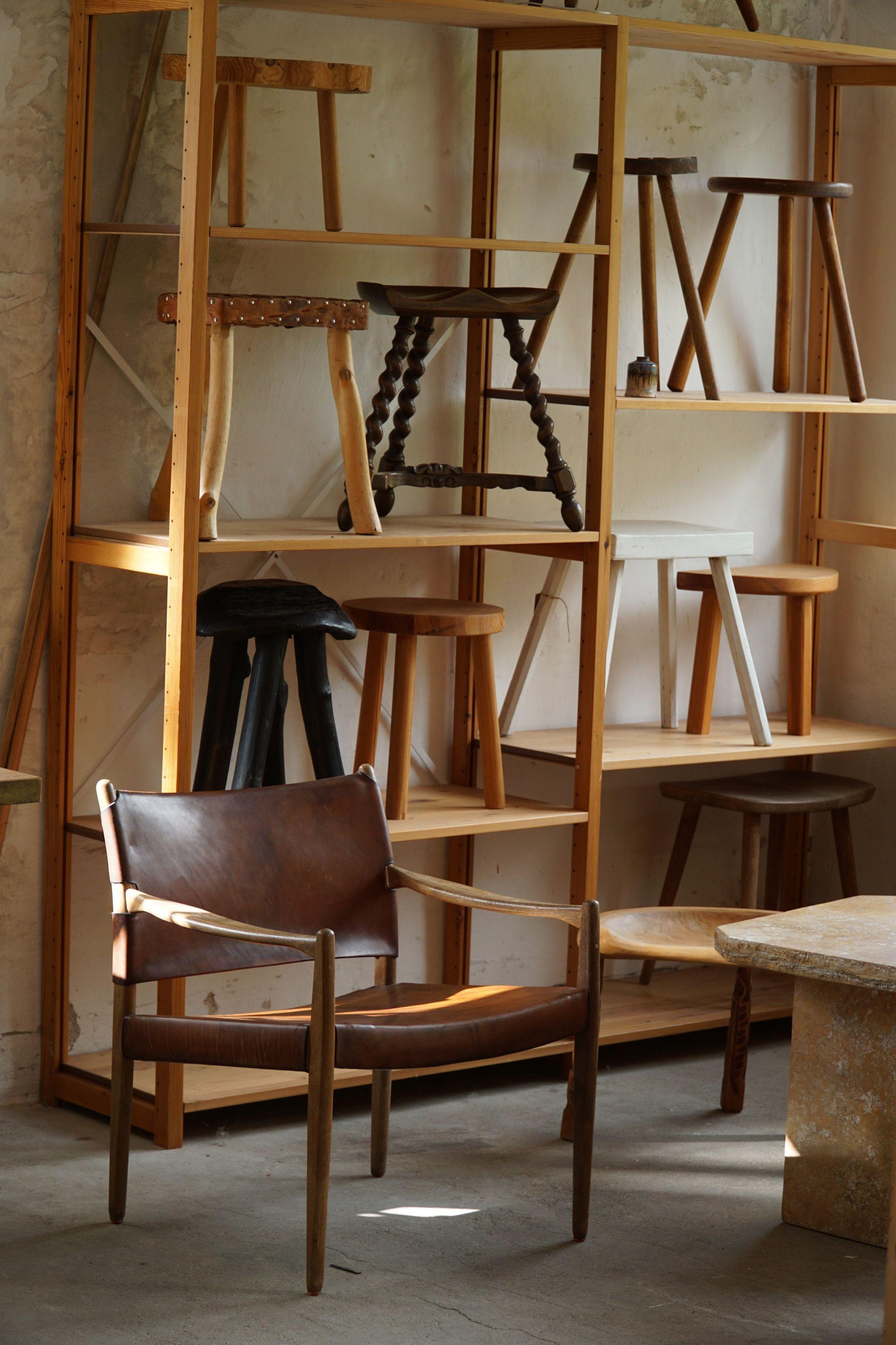 Swedish modern armchair in solid oak, upholstered in thick saddle leather. Made by Per Olof Scotte for IKEA in 1969. Model 