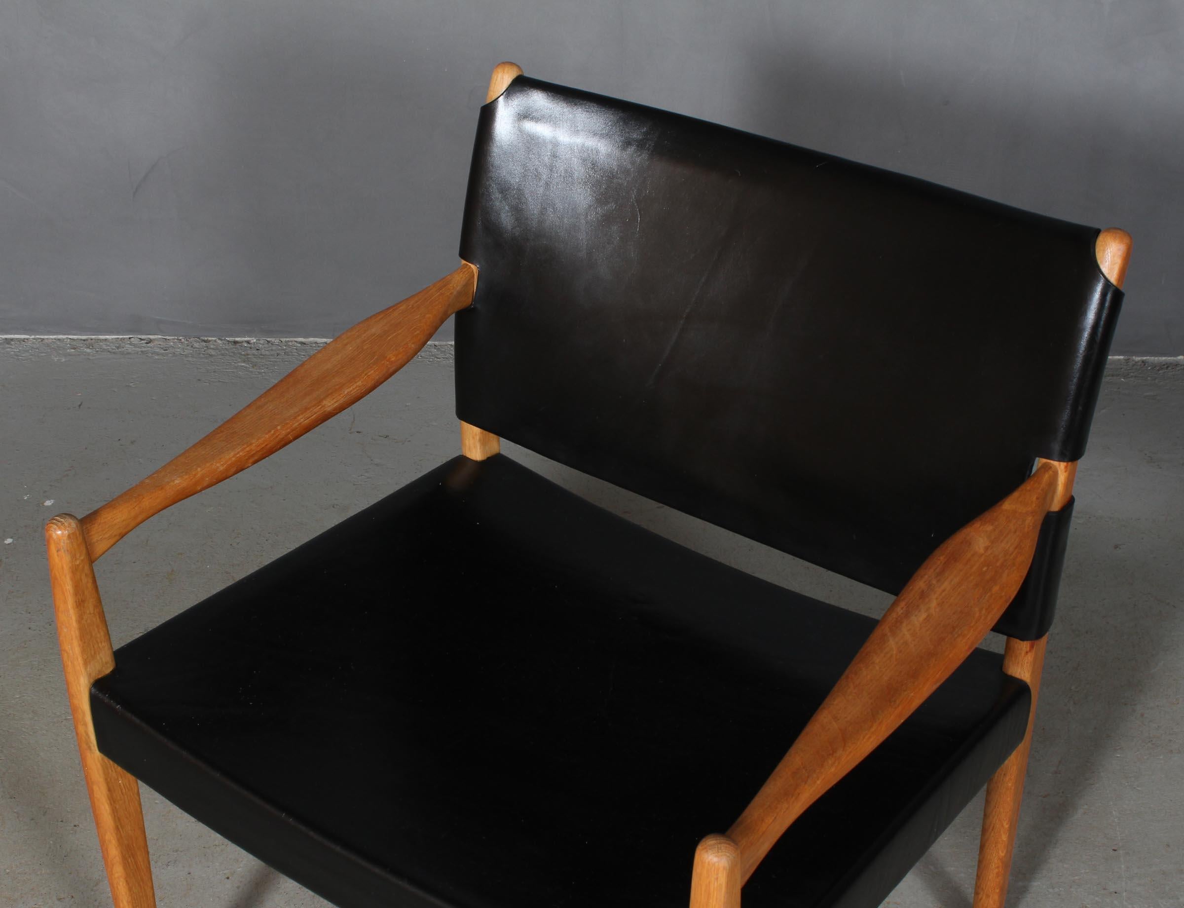 Per Olf Scotte for Ikea lounge chair made of rosewood and black saddle leather.

Model Premiär-69, made for Ikea.