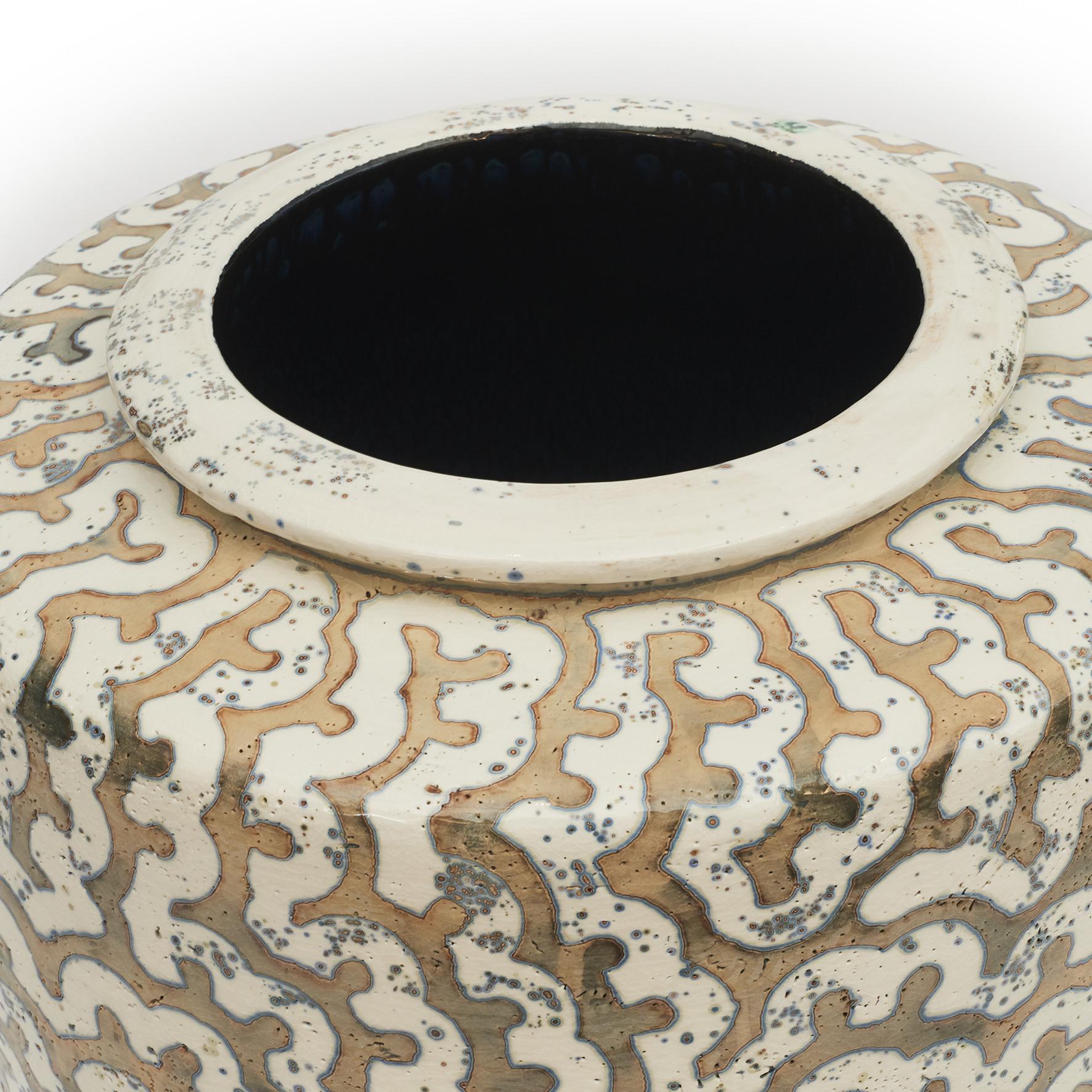 Per Weiss (Danish, born 1953) colossal stoneware floor vase with relief windings. Beautiful stoneware decorated in white, blue and grey-brown glaze. Artist signature stamp on rim.
Handmade, unique.