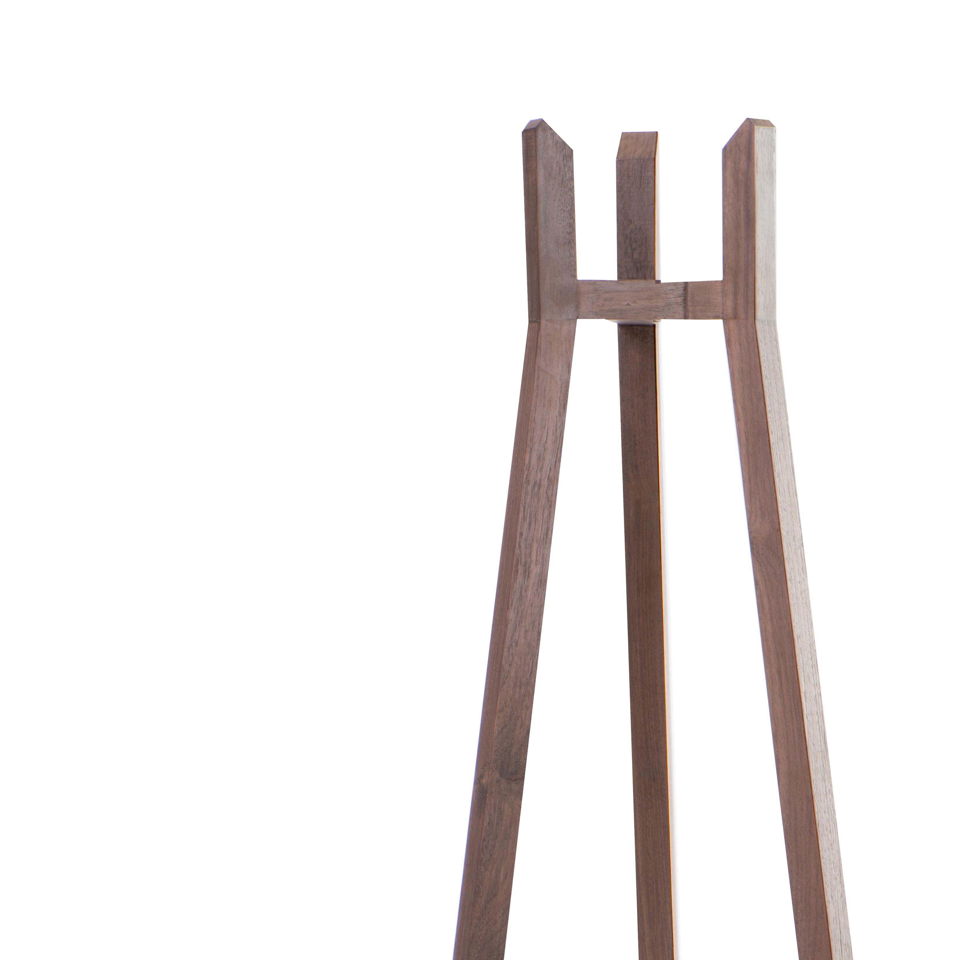 The simplicity and set of angles of the collection merge into the coat stand. Designed with thin lines, but with great strength and stability. Produced in three different types of wood: tzalam, walnut and oak.