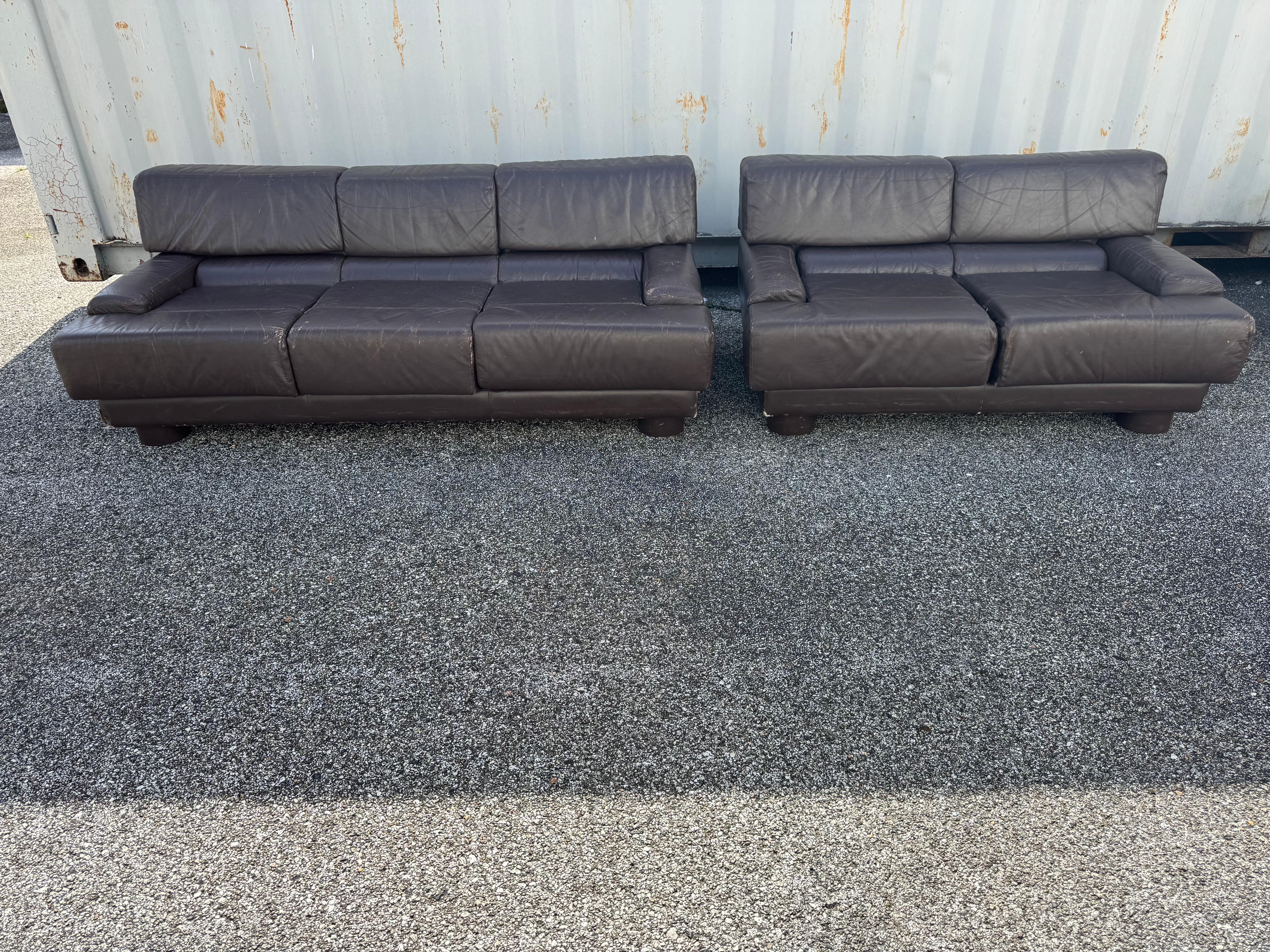 This is a rare Percival Lafer sofa and loveseat.  Its comprised of a 3 seat sofa and a 2 seat loveseat. The set is upholstered in a brown leather fabric. The set was made in Brazil. 

Pair of matching lounge chairs also available.

Dimensions:
2