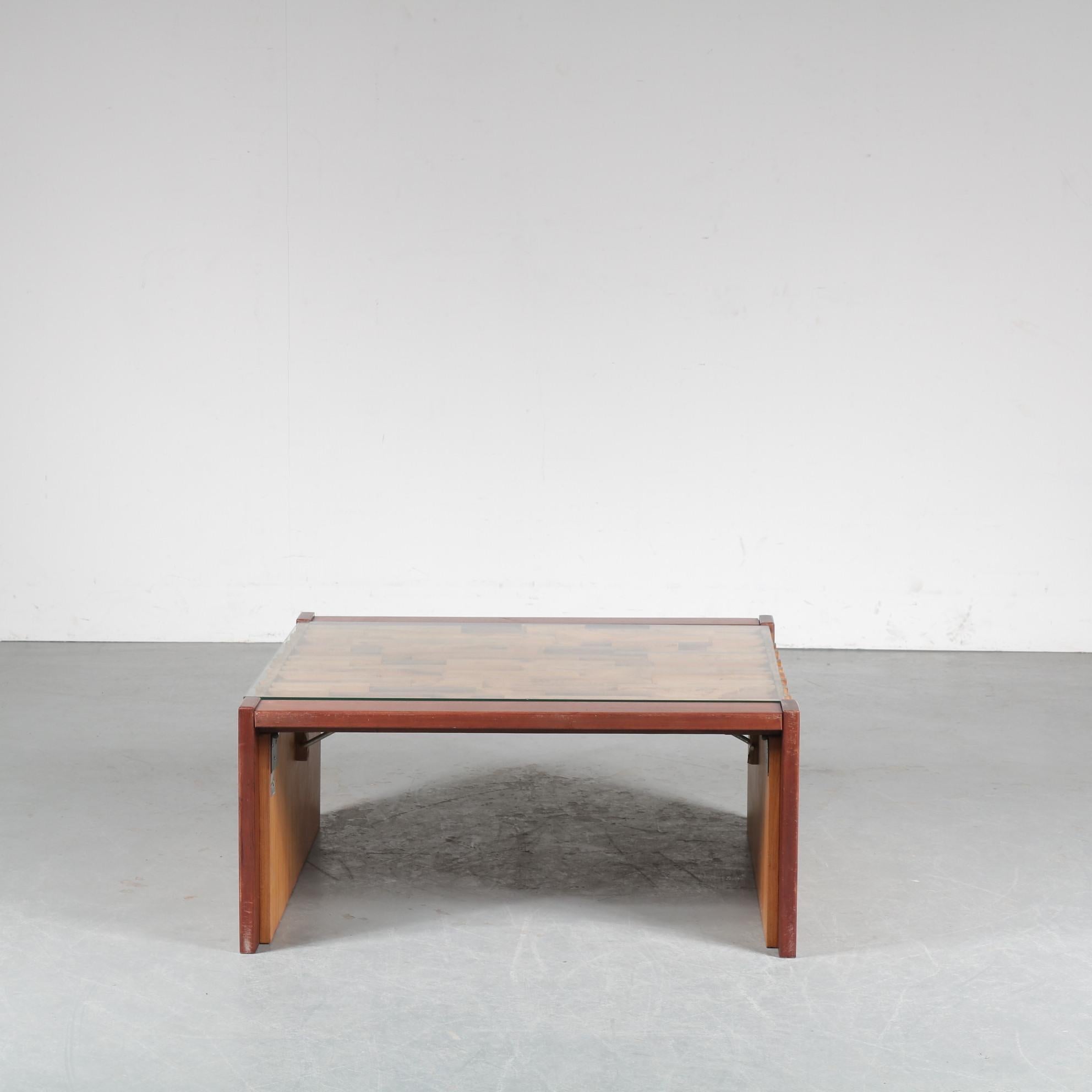 A beautiful coffee table designed by Percival Lafer in Brazil, circa 1960.

This amazing piece is made of high quality tropical hardwood that is very well crafted in different layers, giving the table a nice style. It’s clear glass top gives it an