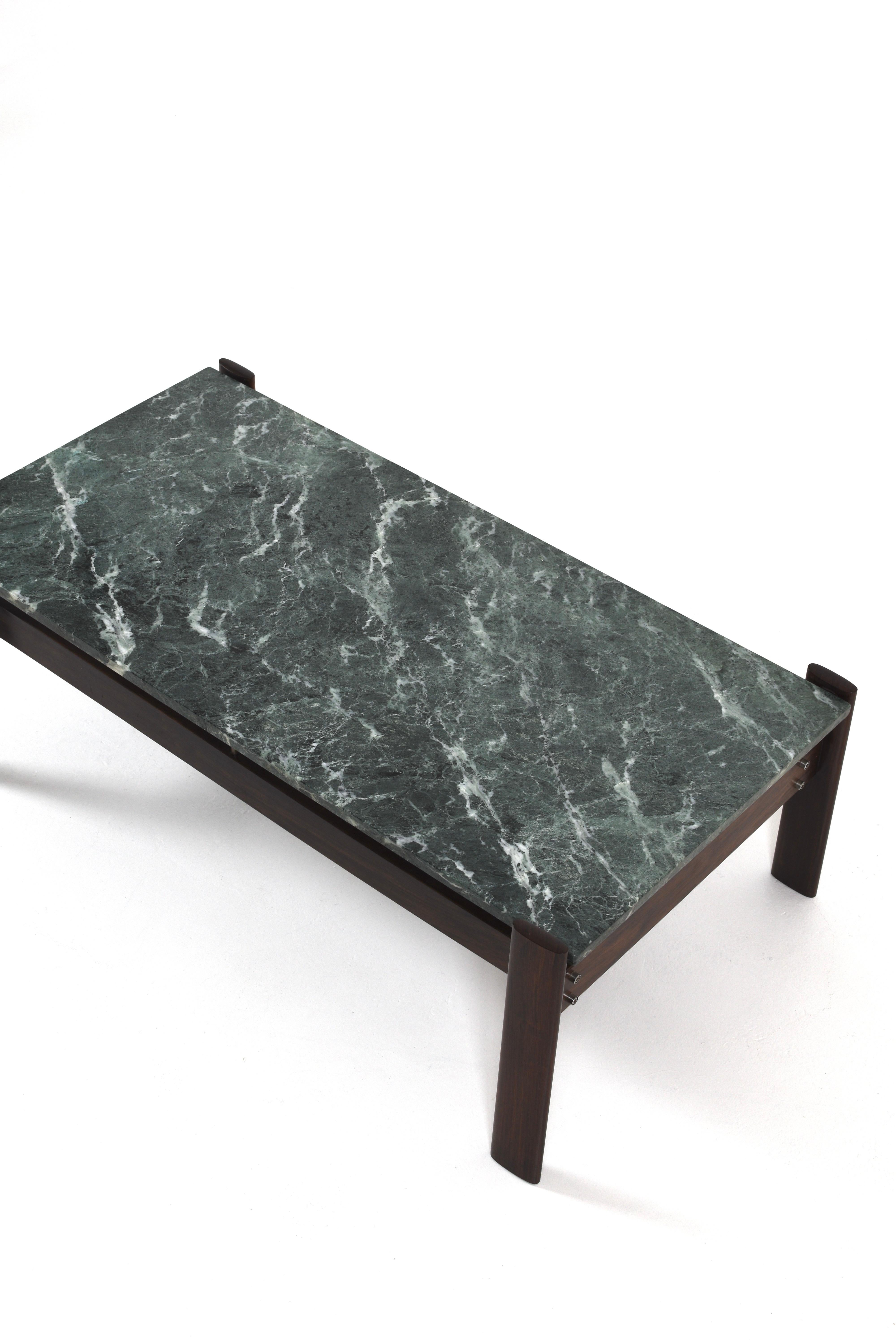 Striking Brazilian Modernist coffee table by Percival Lafer, crafted in the 1970s. Featuring a rich green marble top with bold veining, supported by a sculptural wood frame. A rare and elegant statement piece from Brazil’s design golden age.

We