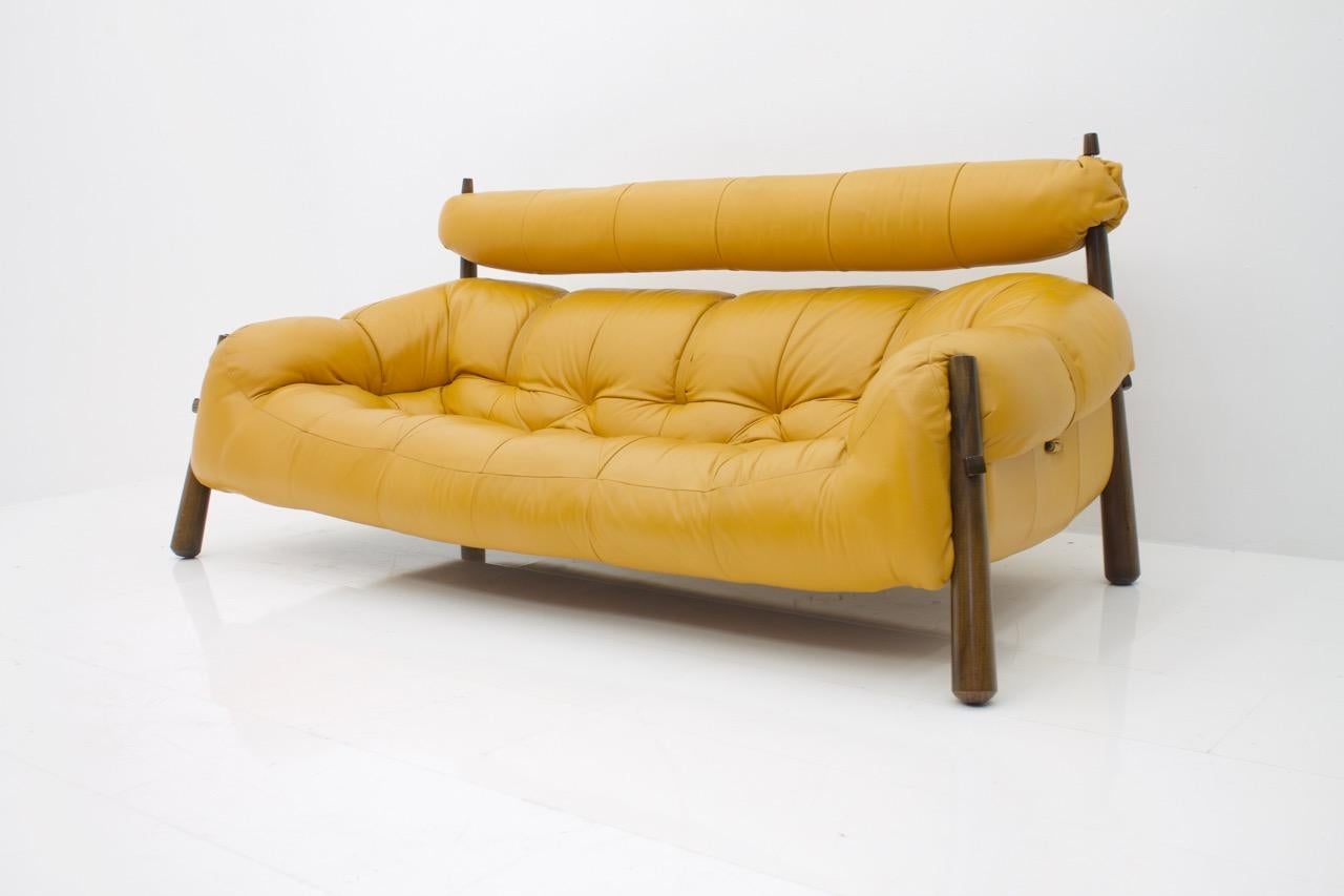 Leather sofa by Percival Lafer model MP-81, Brazil, 1972. Very comfortable sofa in a very good condition. The upholstery and the leather is in excellent condition. The color is between ochre yellow and cognac brown.
 