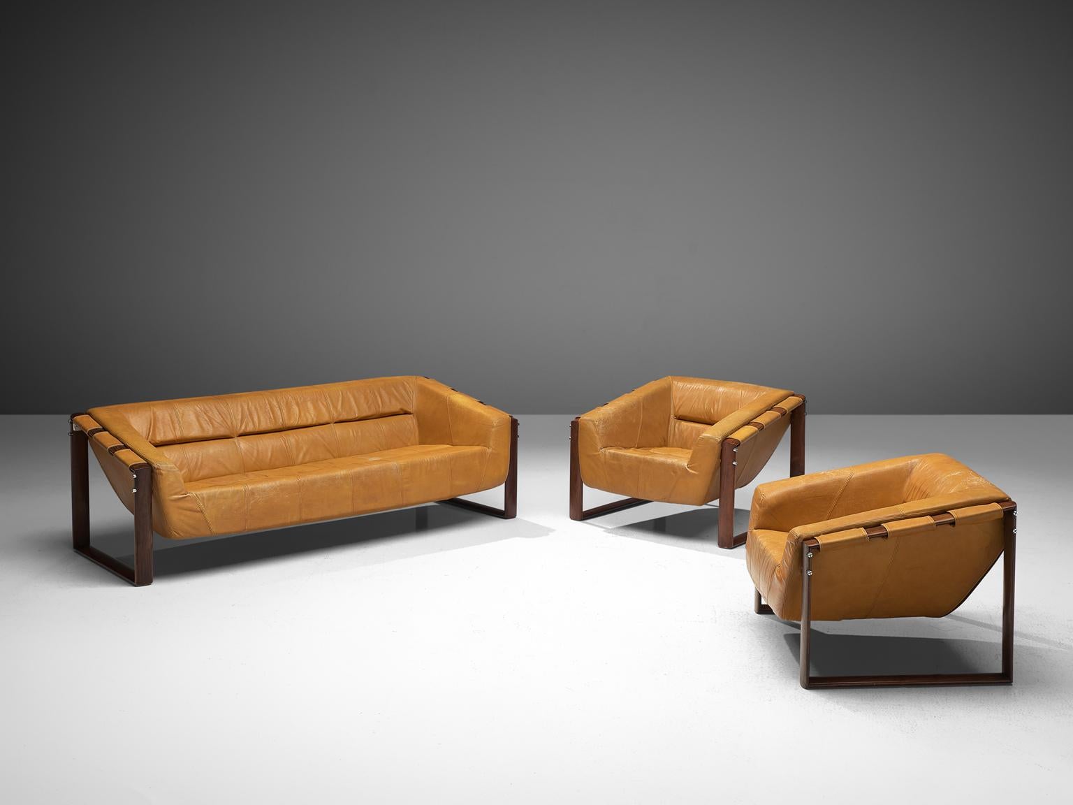 Percival Lafer, living room set, leather and rosewood, Brazil, late 1960s.

A wonderful lounge set by Brazilian designer Percival Lafer, consisting of two lounge chairs and one sofa. Every piece of furniture consists of two geometric shaped