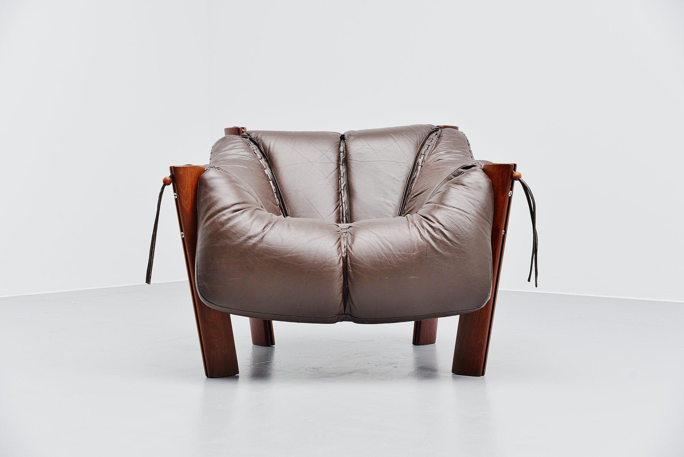 Very nice comfortable lounge chair designed and manufactured by Percival Lafer, Brazil, 1960. This chair has 4 mahogany legs and a dark brown leather seat. The legs are connected with chrome screws, nicely shaped. Very nice and typical Brazilian