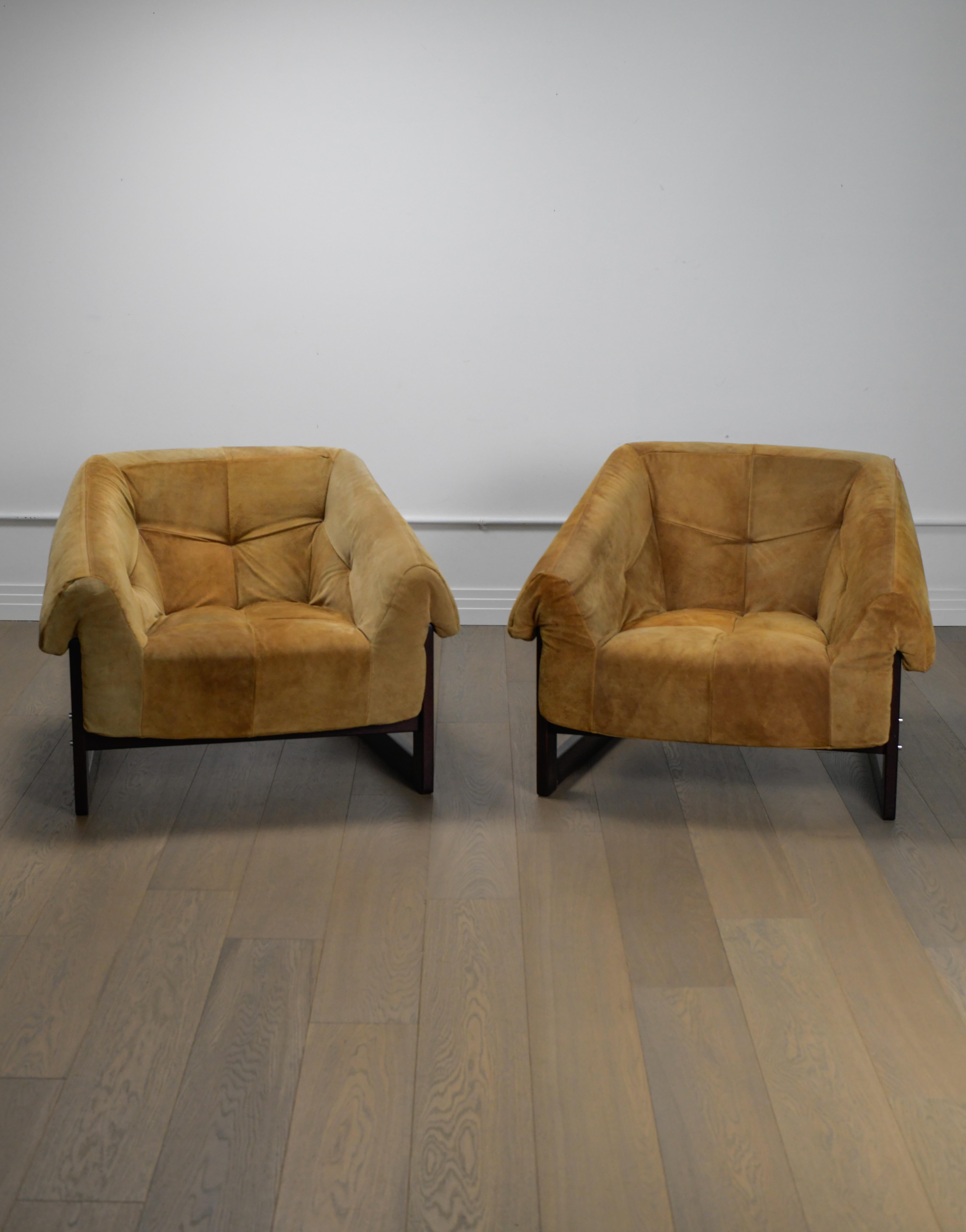 Pair of 1970 Percival Lafer lounge chairs in a beautiful honey suede upholstery with rosewood bases. Produced by Lafer S.A. - These chairs are in good vintage condition with a beautiful patina appropriate with their age. Manufacturers label on the