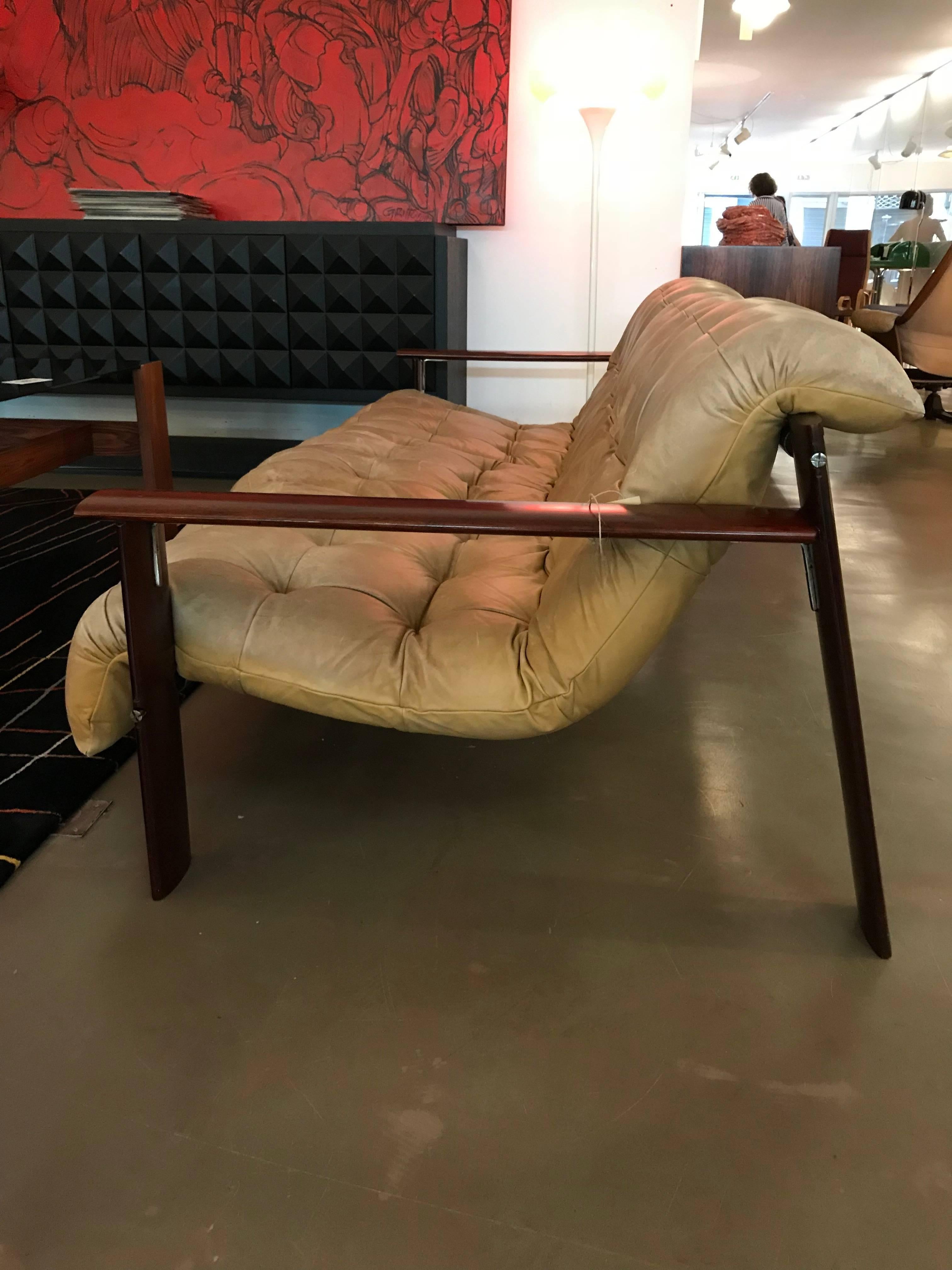Percival Lafer low lounge three-seat sofa in a very good condition. The rosewood structure is in excellent condition. The leather with signs of use.