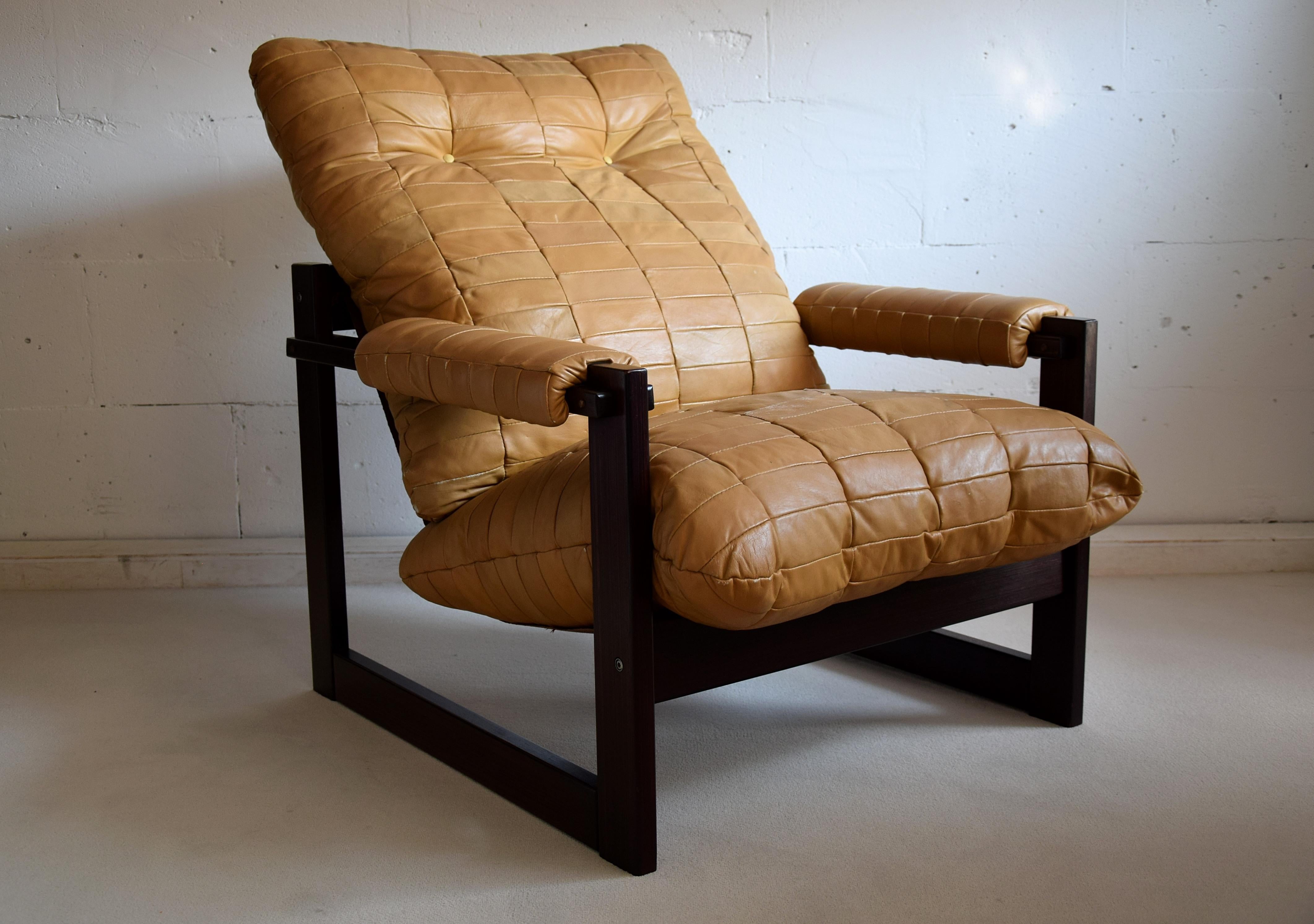 Stylish Mid-Century Modern lounge chair designed and produced by Percival Lafer In Sào Paulo Brazil. The Brazilian Jatoba structure is in good condition and the chair still has it's original camel color leather upholstery. This chair was made on the