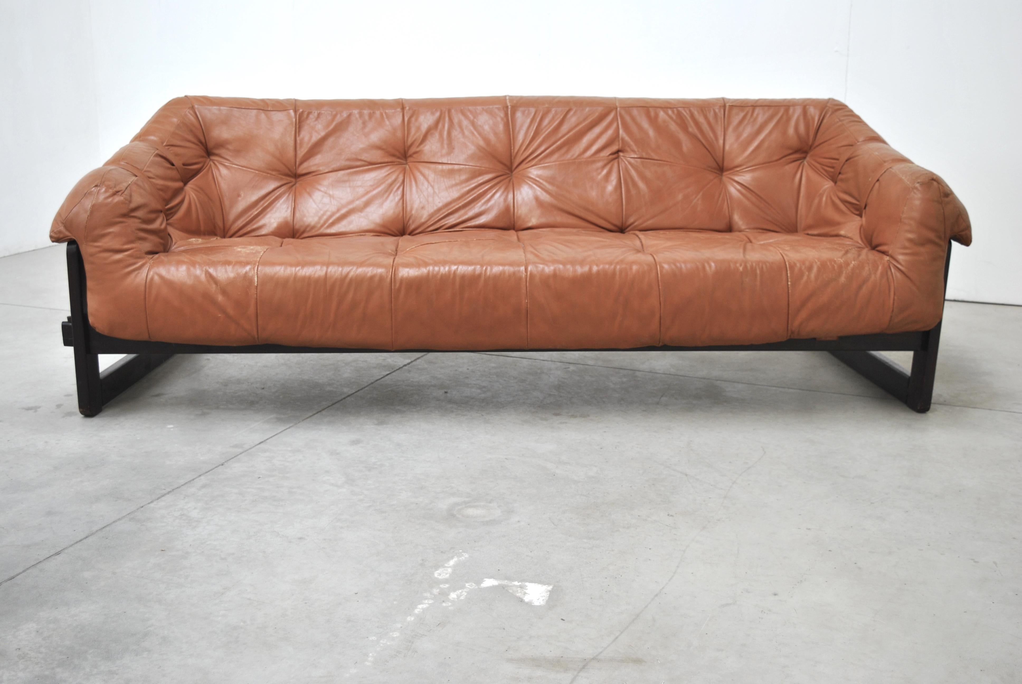  Sofa by Percival Lafer. Brazilian rosewood and original leather. Really unique design and construction make this a true statement piece.
   
