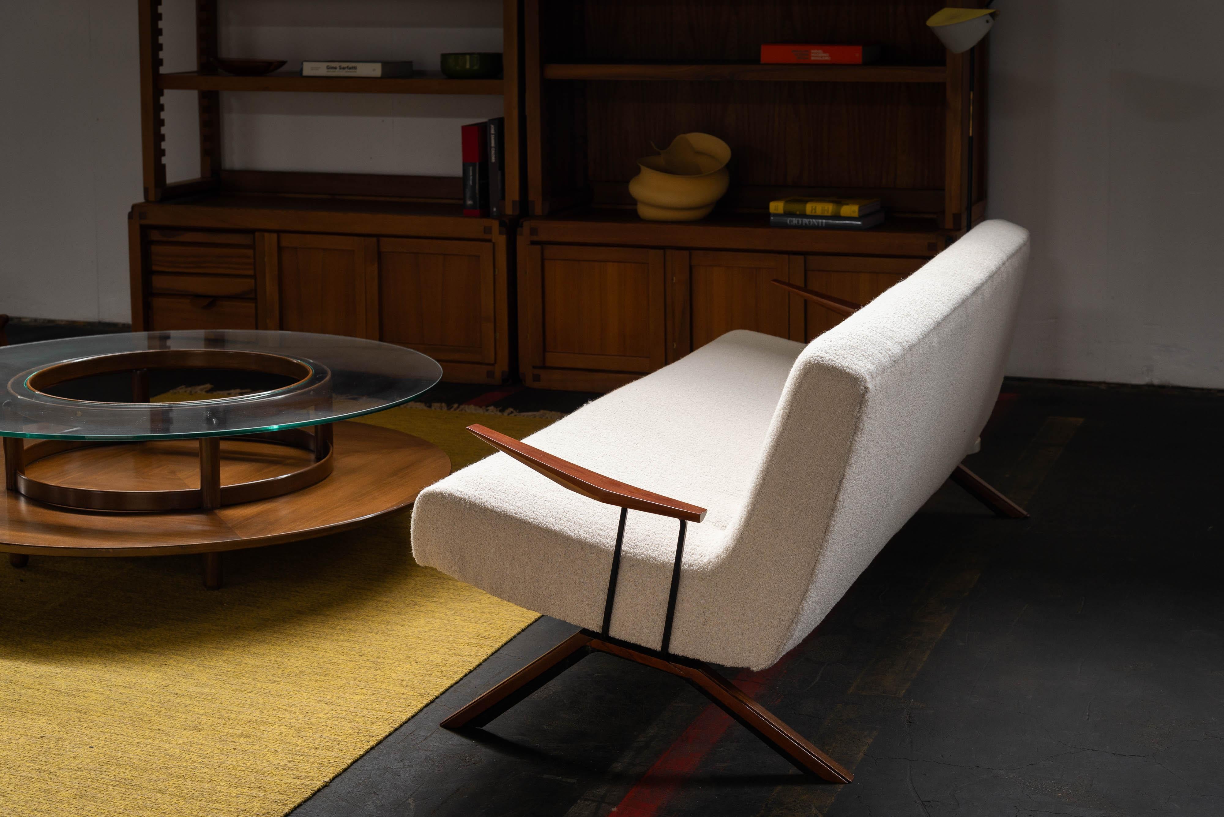 Rare sofa designed by Percival Lafer and manufactured by Lafer MP, Brazil 1961. The steel structure is covered with beautiful warm brown grained hardwood. The seat is reupholstered in an off-white bouclé which looks a lot like faux sheep fur. The
