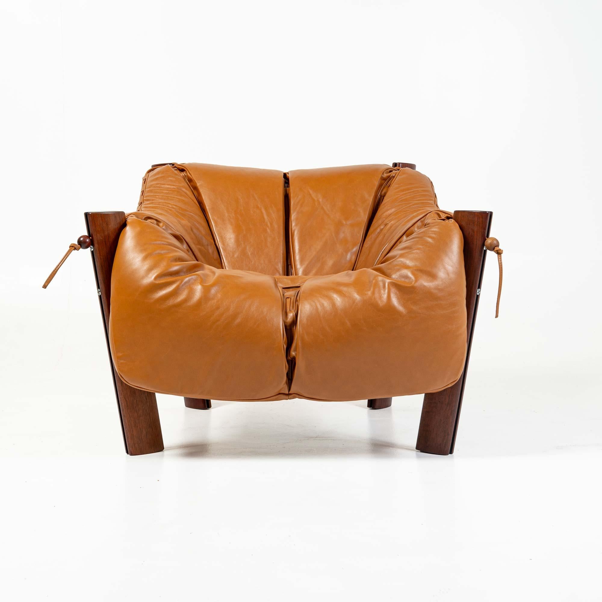 A highly sought after Percival Lafer Lounge chair model MP-211 in original Brazilian rosewood wood and re-upholstered in Maharam Sorghum cognac leather. In his unique designs, Lafer sought ergonomy and comfort making this sofa a true statement. It's