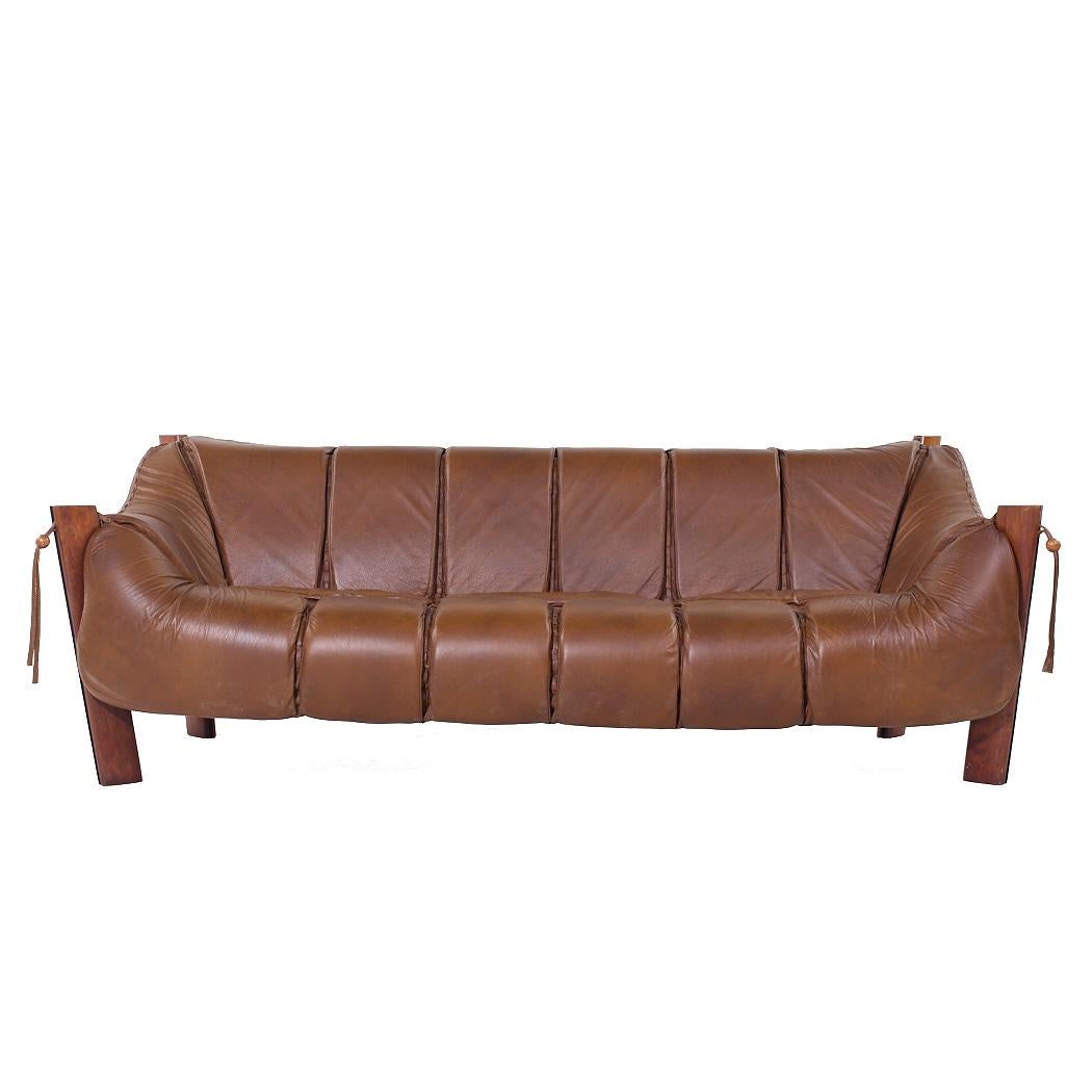 Percival Lafer MP-211 Mid Century Brazilian Rosewood and Leather Sofa

This sofa measures: 86 wide x 38 deep x 30.75 inches high, with a seat height of 16 and arm height of 23.5 inches

All pieces of furniture can be had in what we call restored