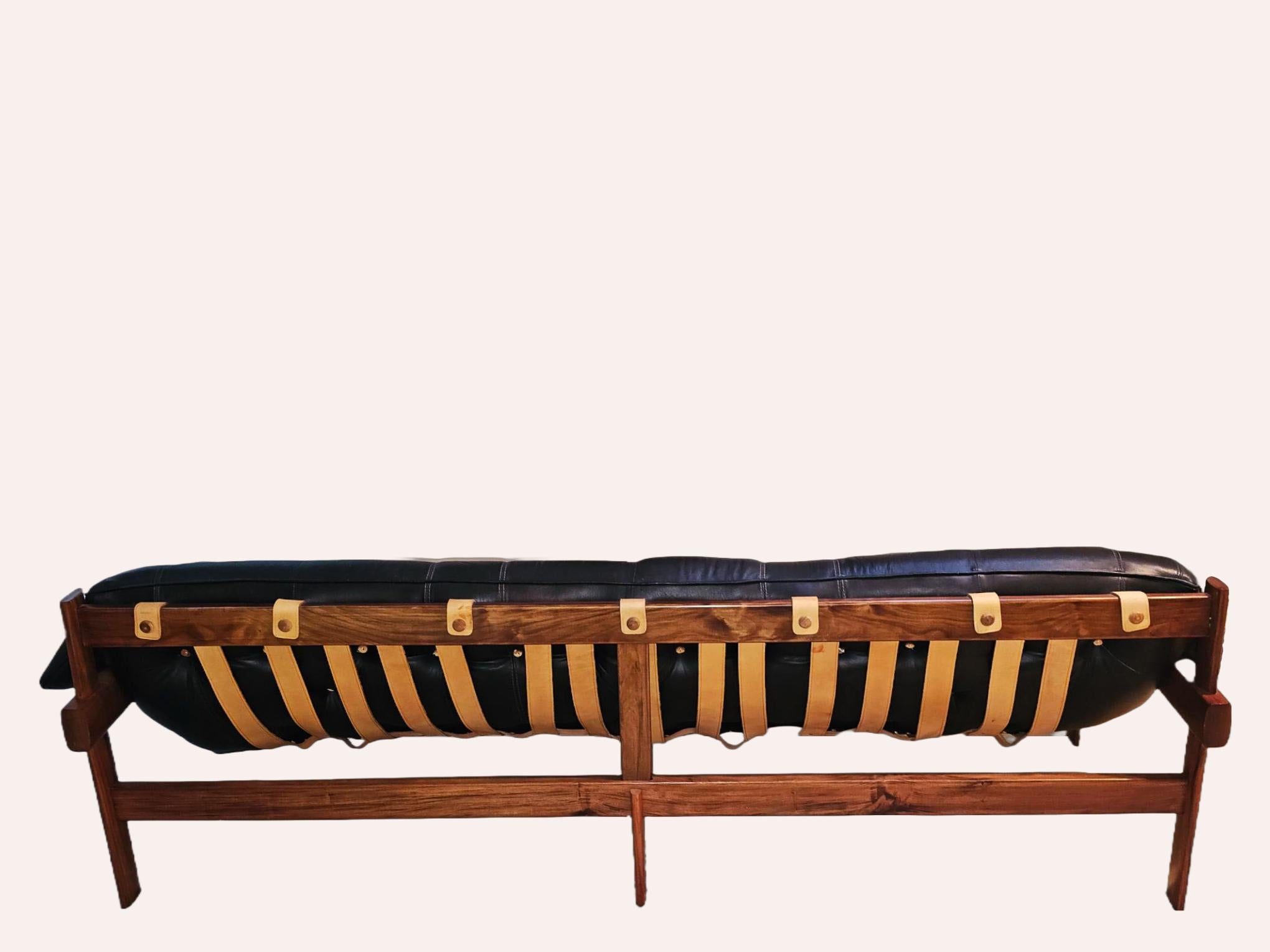 This is our stunning MP-41 three seater sofa in original black leather and jacaranda (Brazilian Rosewood) wood frame. The jacaranda is known as one of the most beautiful woods in the world. This piece was designed by Percival Lafer for MP Lafer,