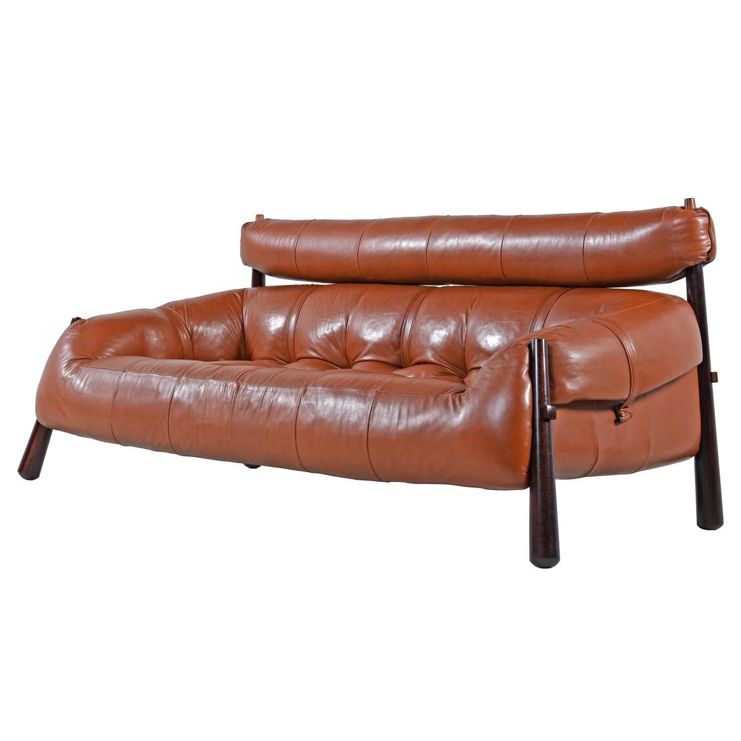 This sofa is even more comfortable than it looks. Nestle into the deep tufted seats and put your head back into the soft, supple leather. Impeccably crafted and beautifully designed, hand-tufted and complete with removable headrest. Solid rosewood
