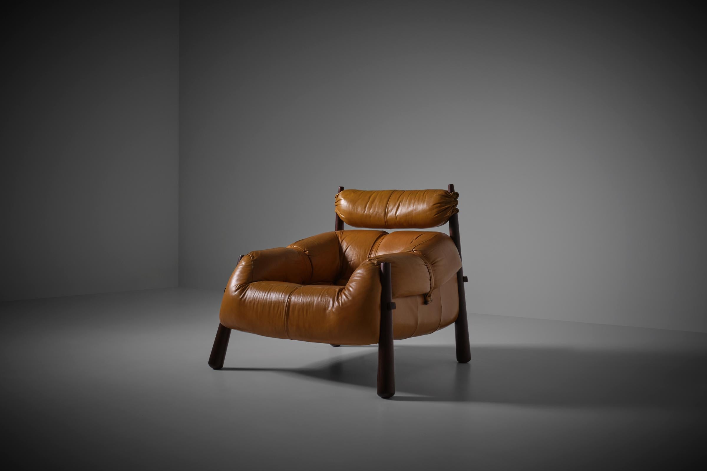 Percival Lafer MP-81 Lounge chair for MP Lafer, Brazil 1972. Outspoken bulky design in a catchy color combination. The chair has its original cognac colored leather which remains in a very good condition; strong and soft, the same counts for the